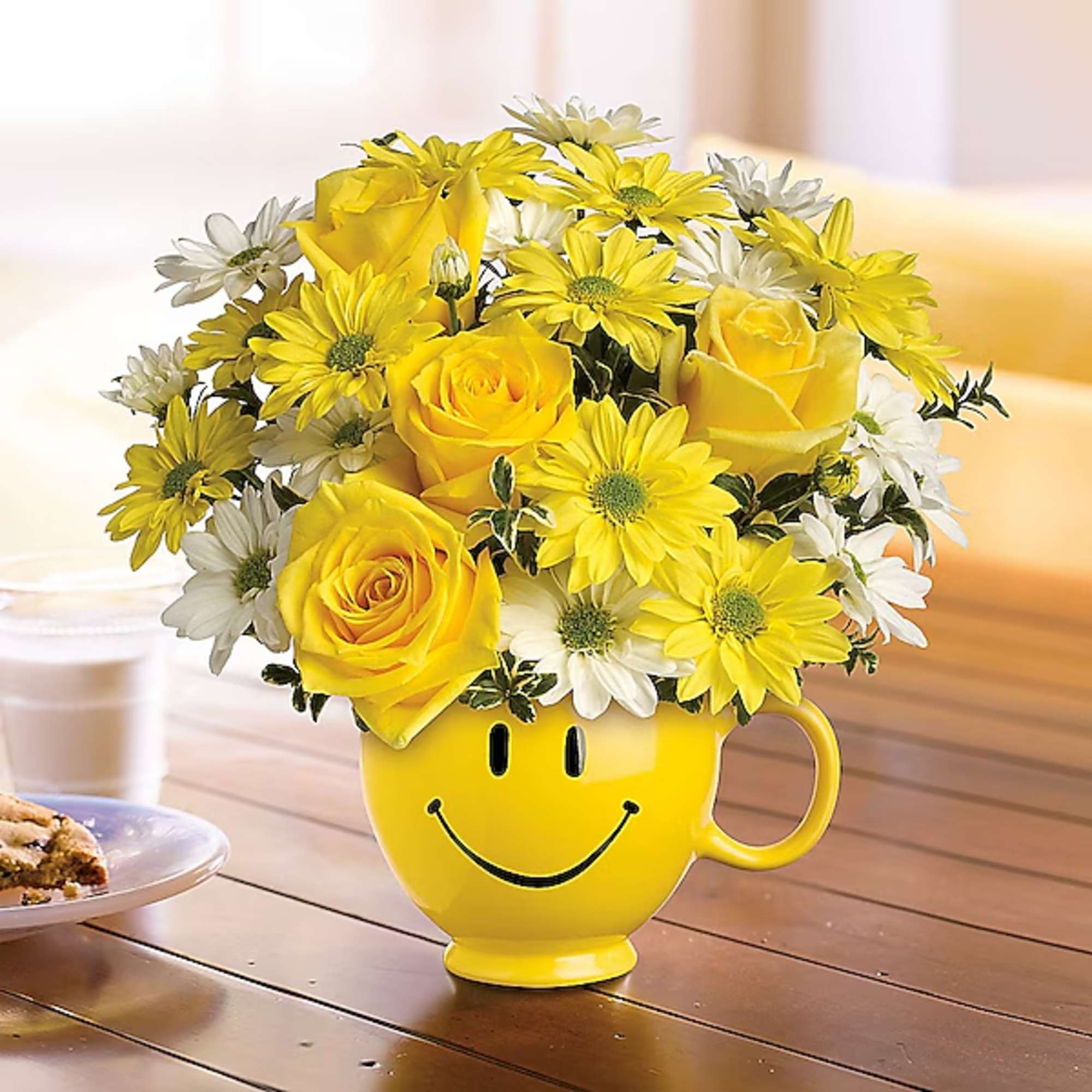 Yellow roses and daisies in a smiley-face mug, photo 2 of 2