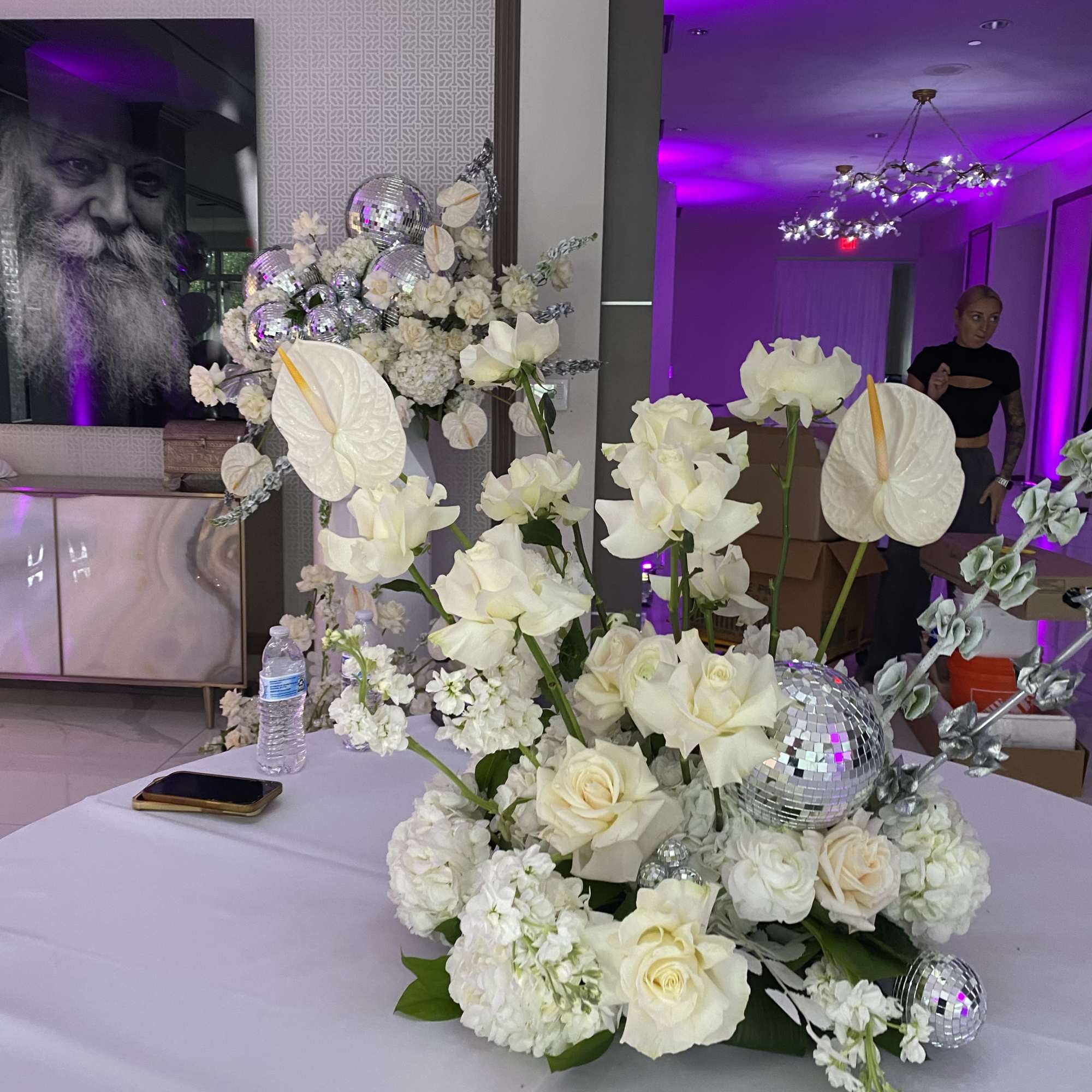 Decoration with variety of white flowers and disco balls. Arrangements of different