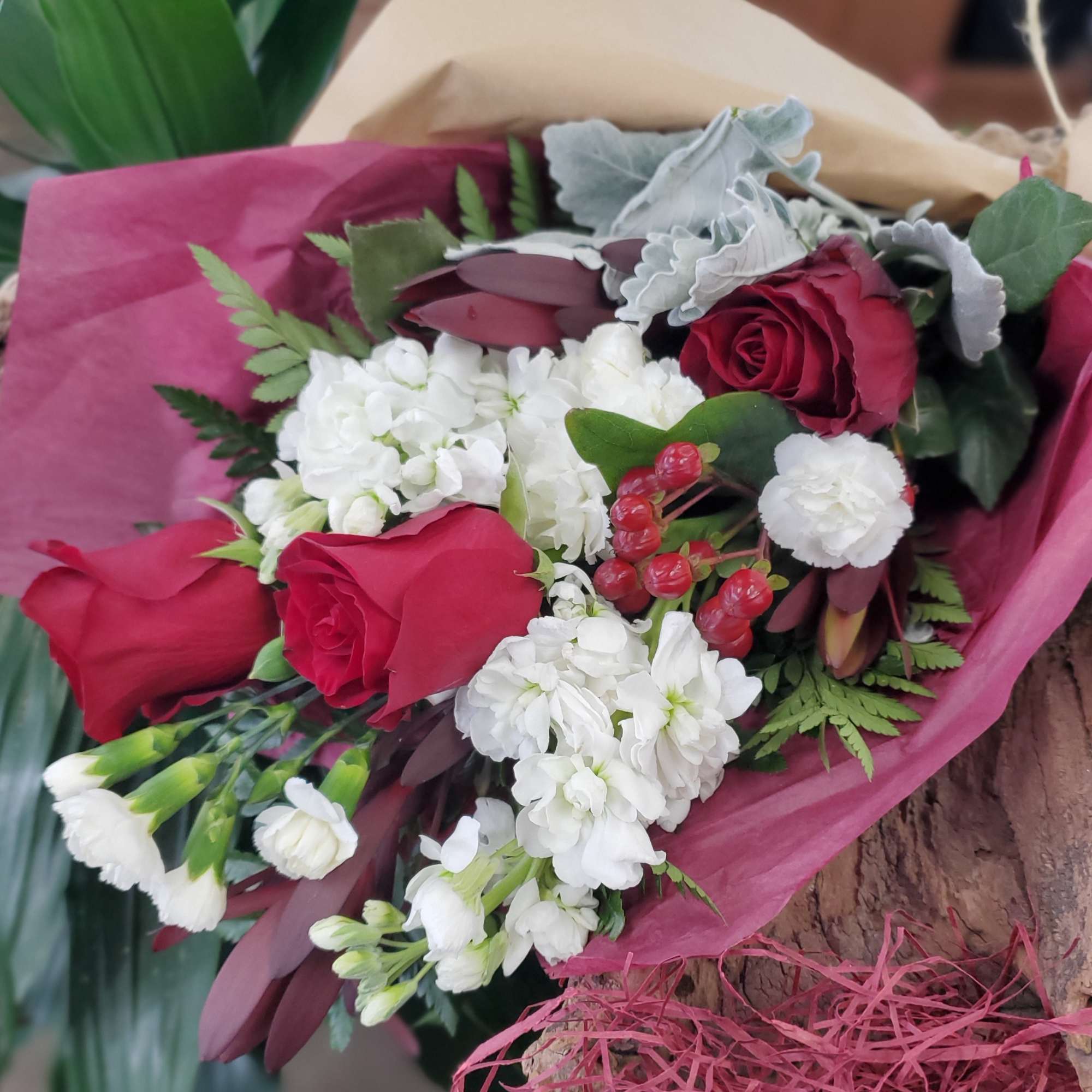 Bouquet of red roses and white flowers wrapped in pink paper, photo 2 of 2