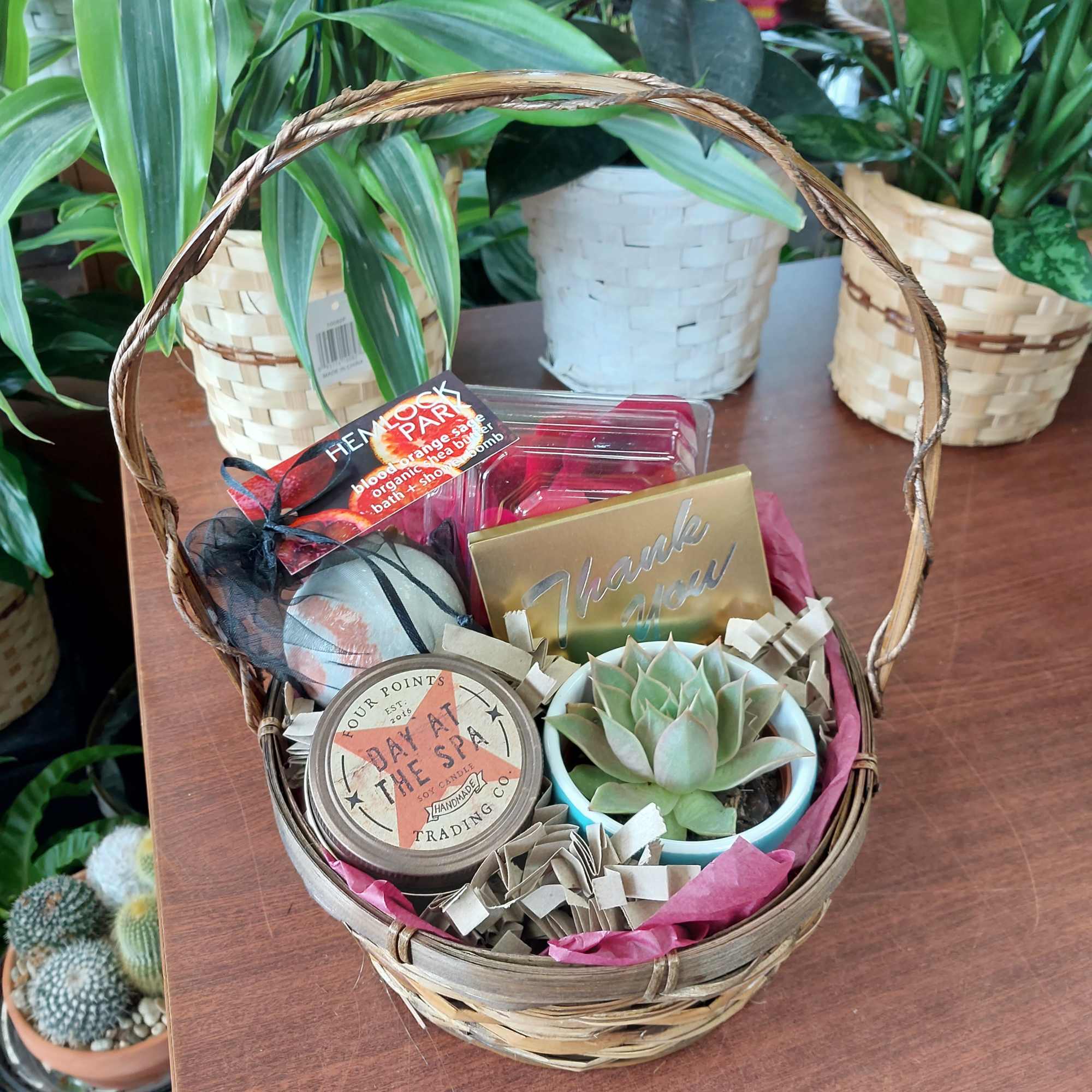 Gift basket with a succulent, candle, bath item, and thank-you card