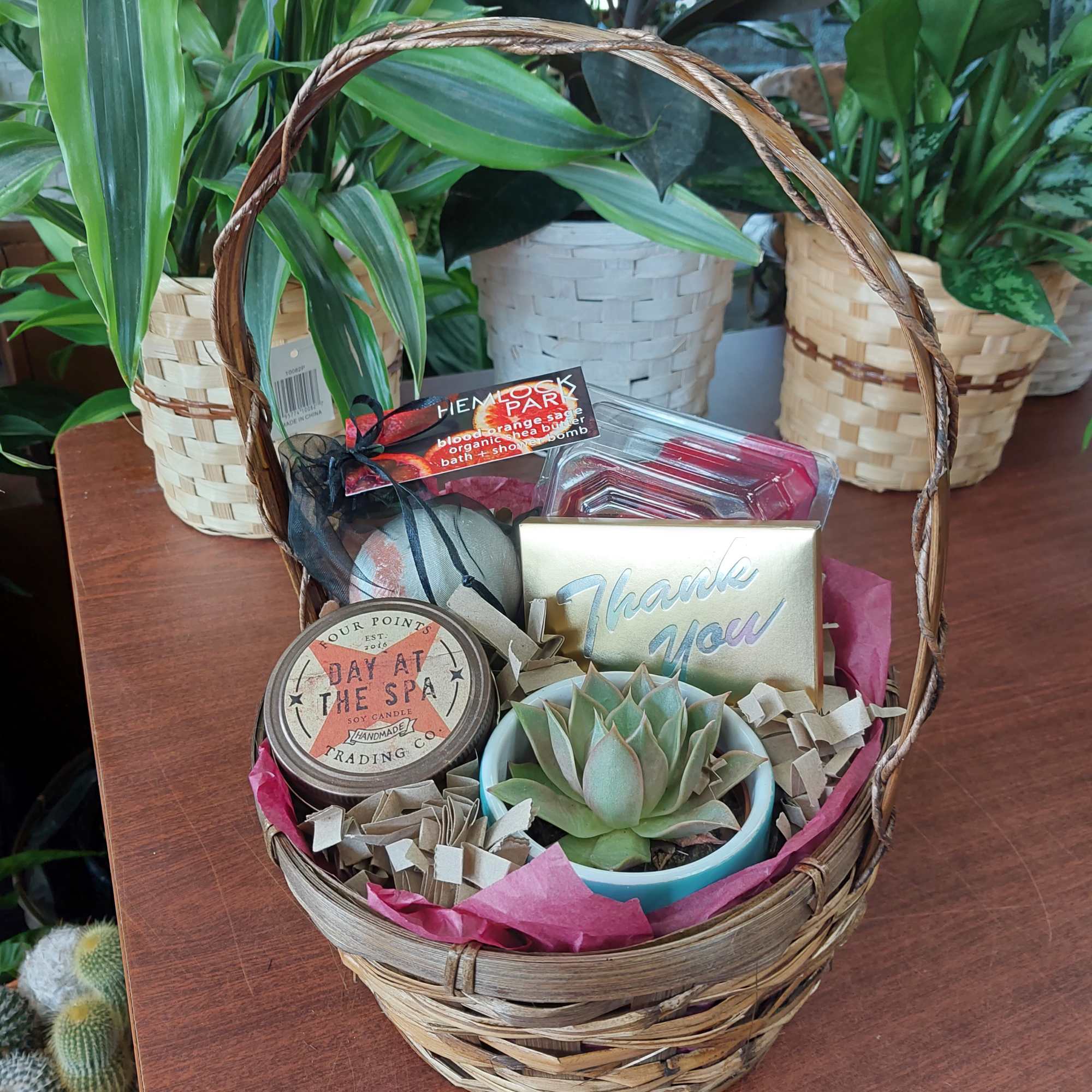 Gift basket with a succulent, candle, soap, and thank-you card