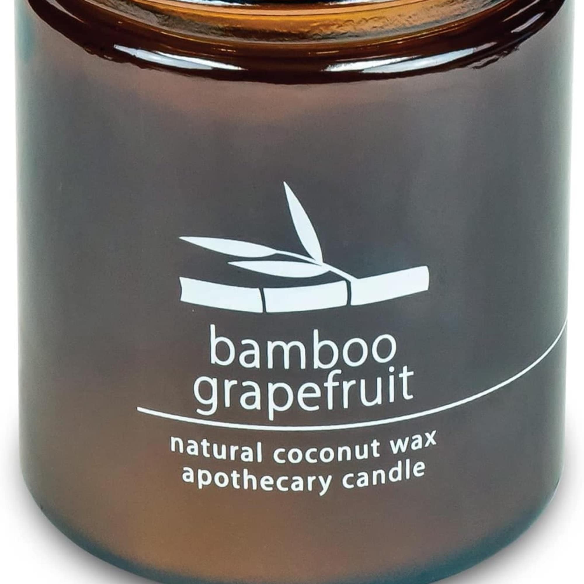 Brown glass candle jar labeled bamboo grapefruit