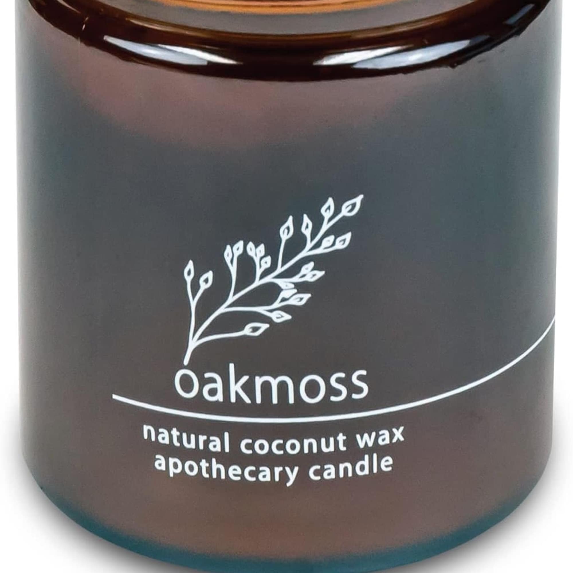 Brown apothecary candle jar labeled Oakmoss