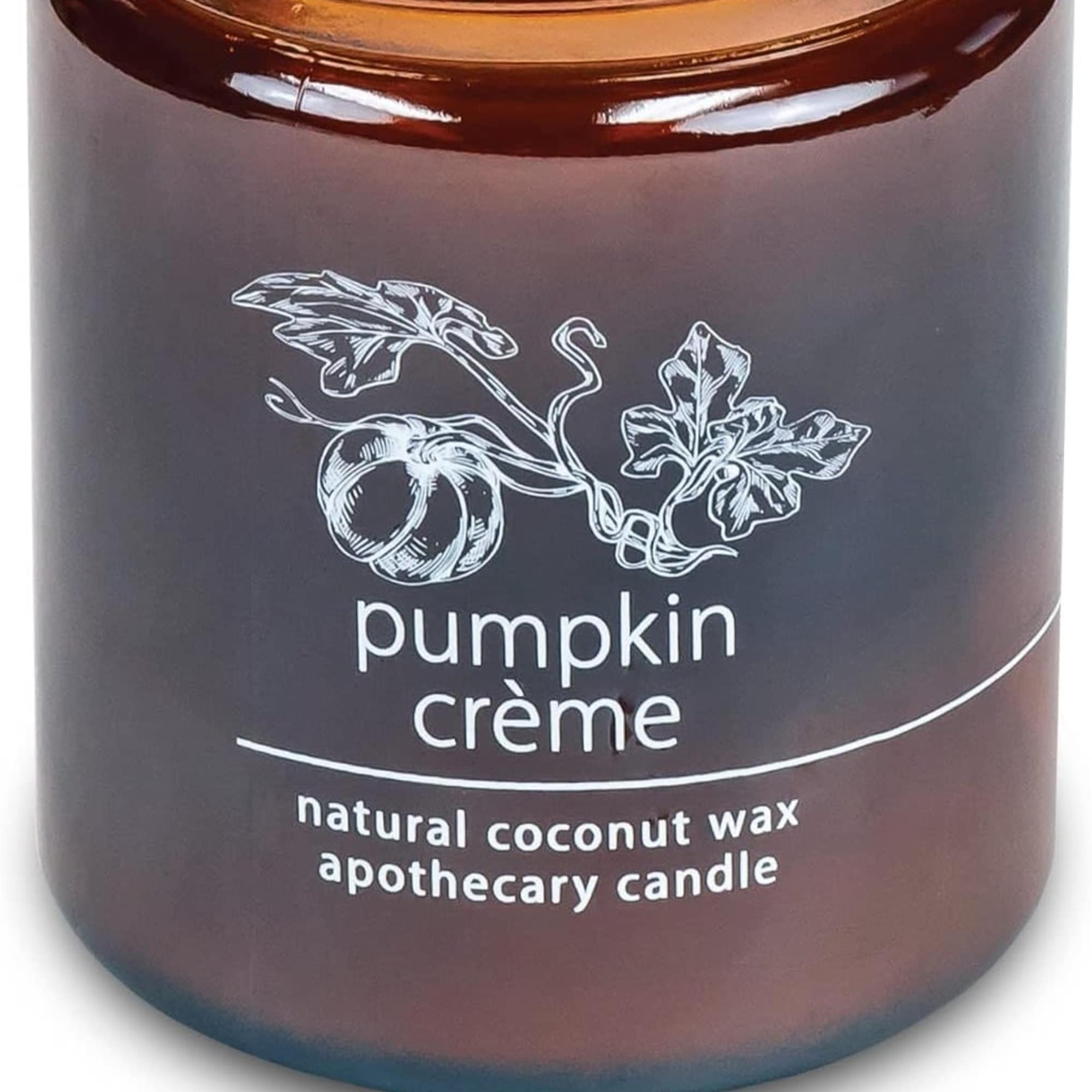 Brown glass candle jar labeled pumpkin crème