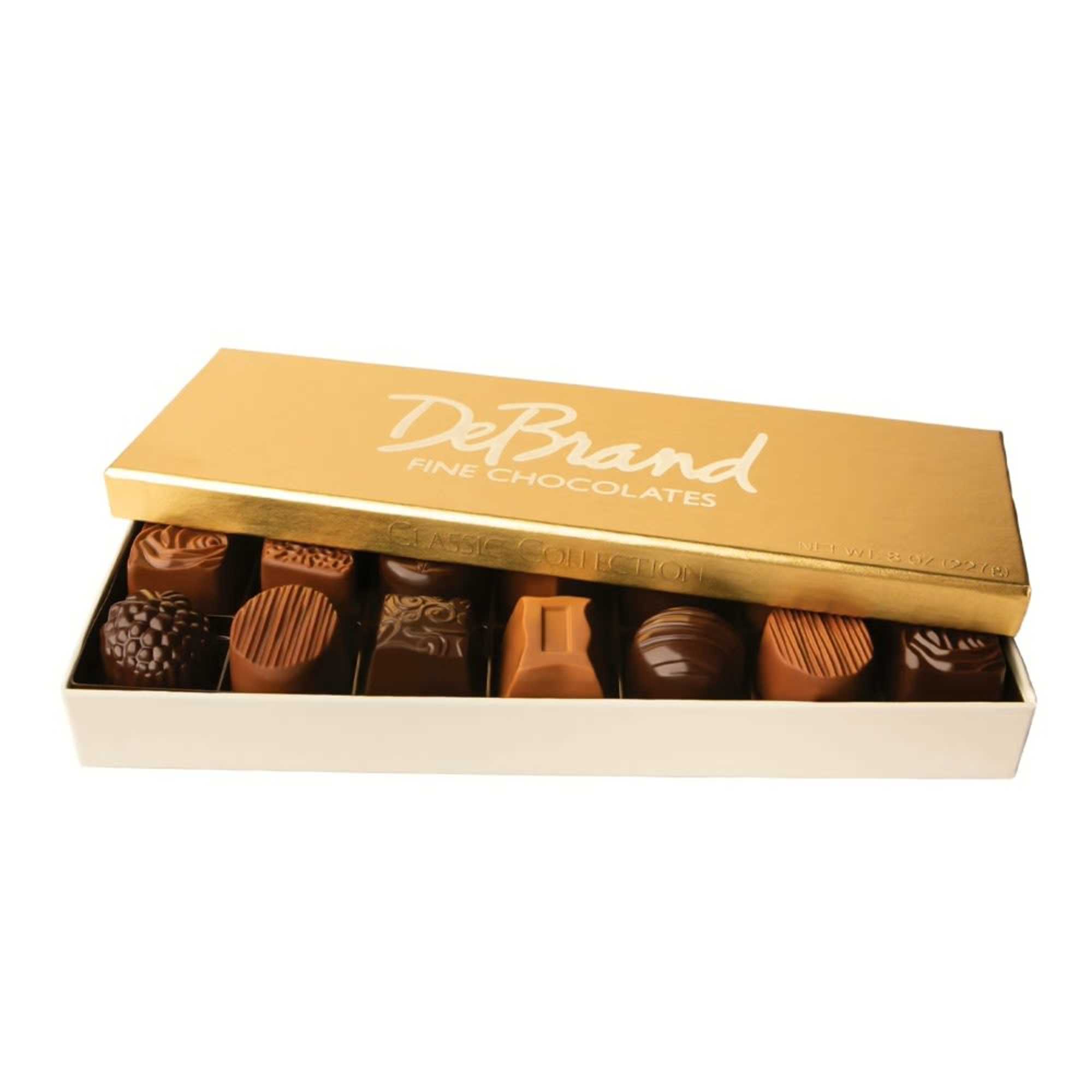 Box of assorted chocolates with a gold lid