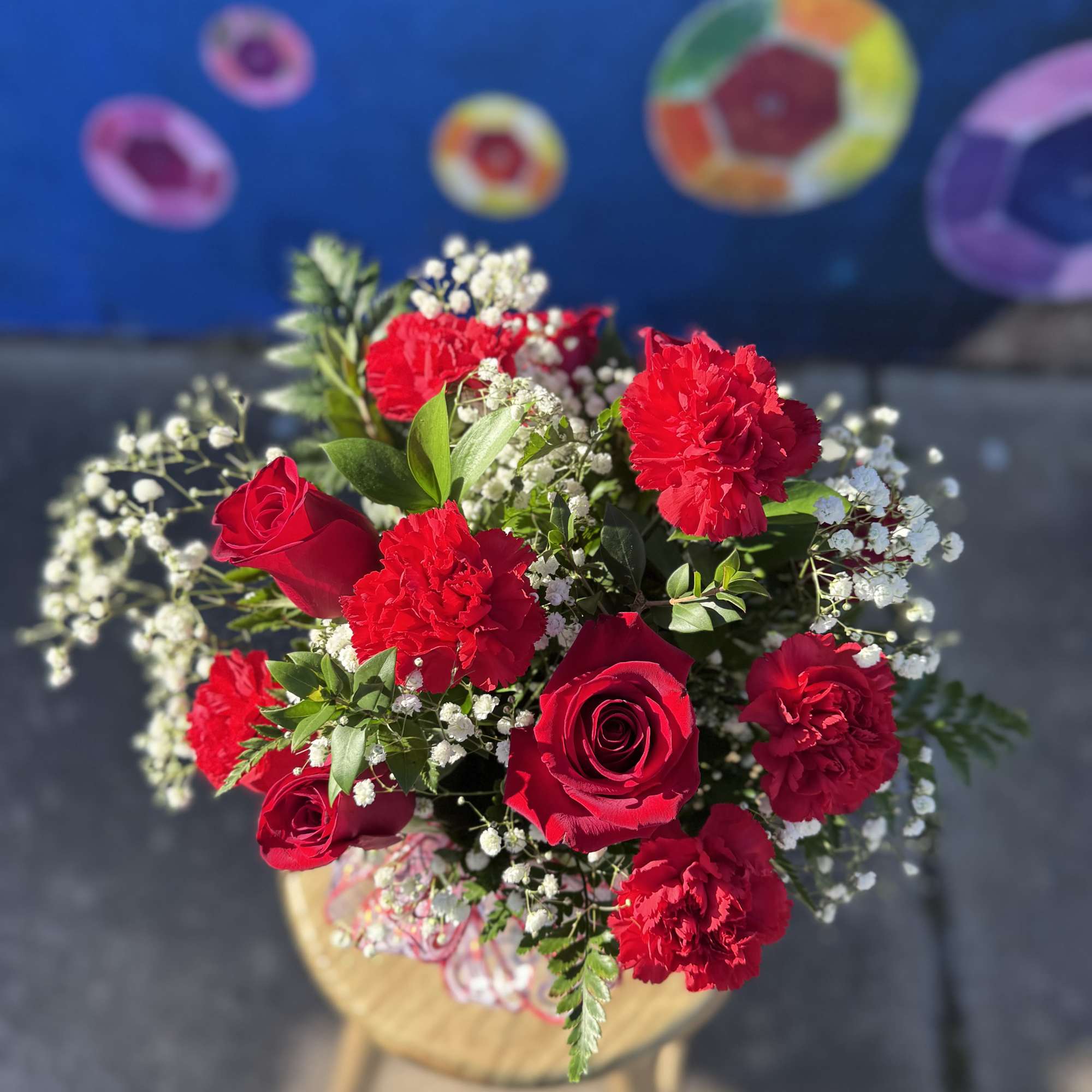 Bouquet of red roses and carnations with white baby's breath