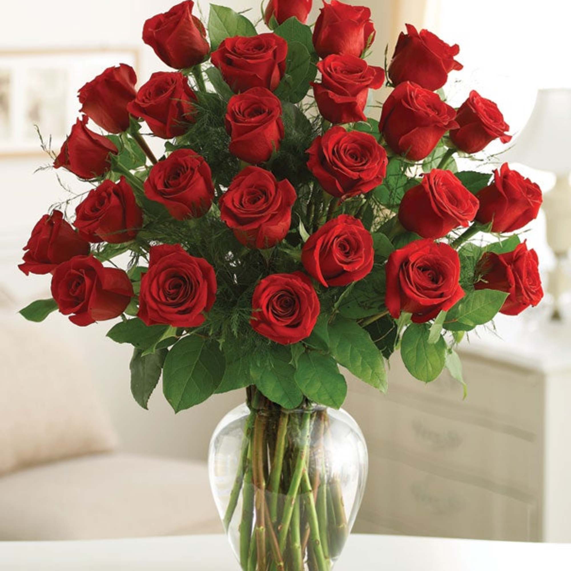 Bouquet of red roses in a clear glass vase