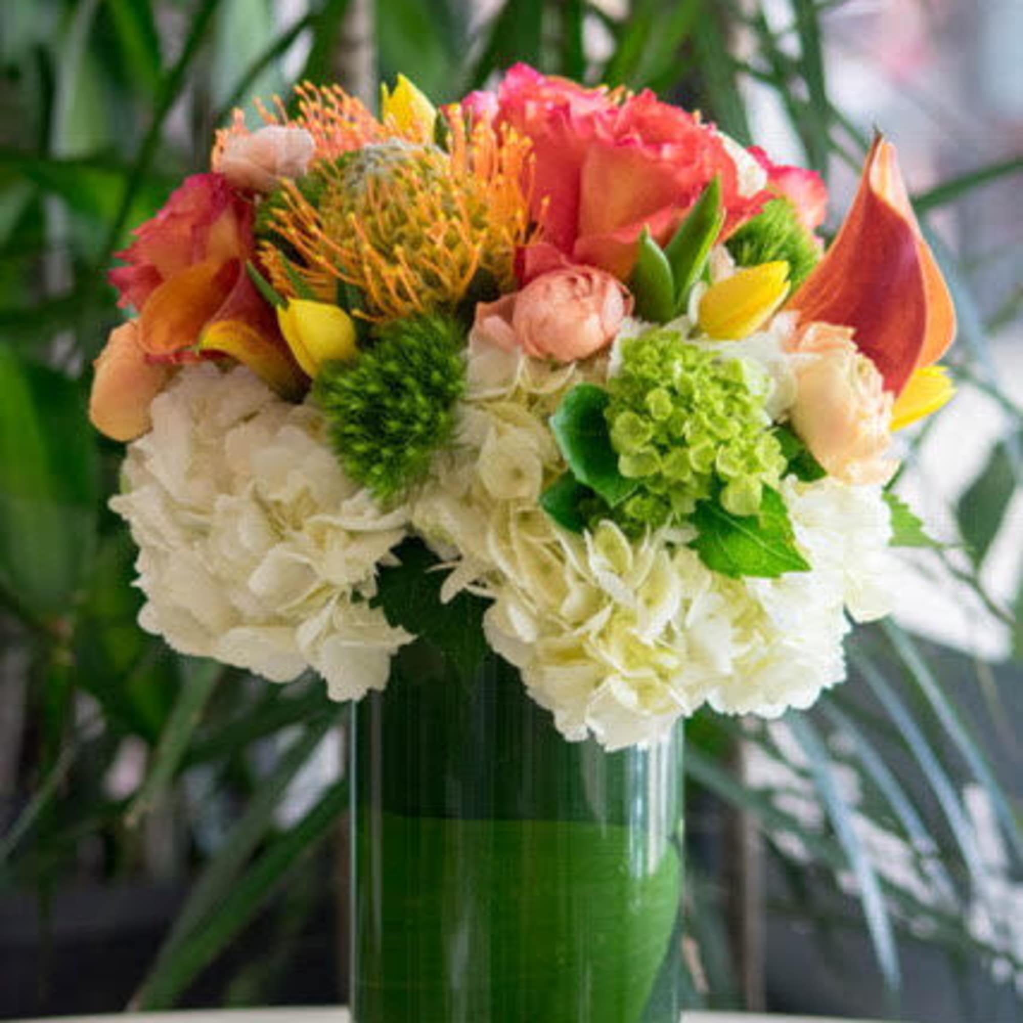 Colorful mixed bouquet in a clear glass vase