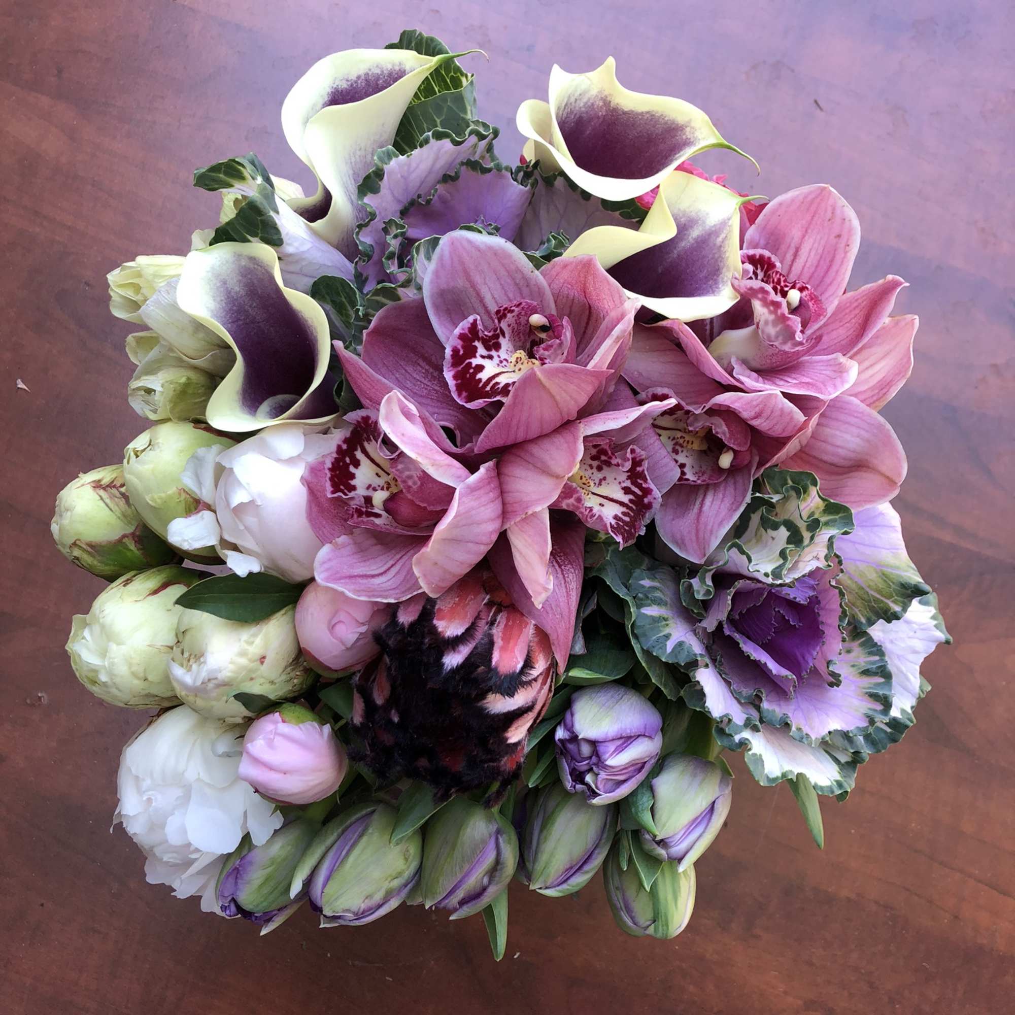Bouquet of pink orchids and white-purple calla lilies
