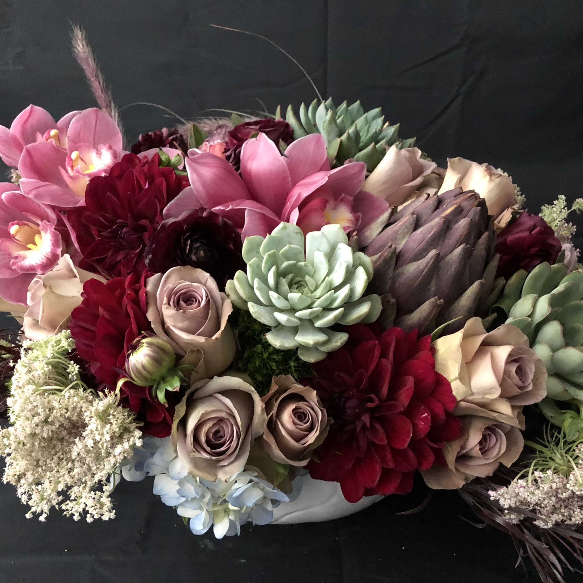 Succulents, roses, antique hydrangeas, scabiosas, anemones, ranunculus, kale and proteas just to, photo 2 of 4