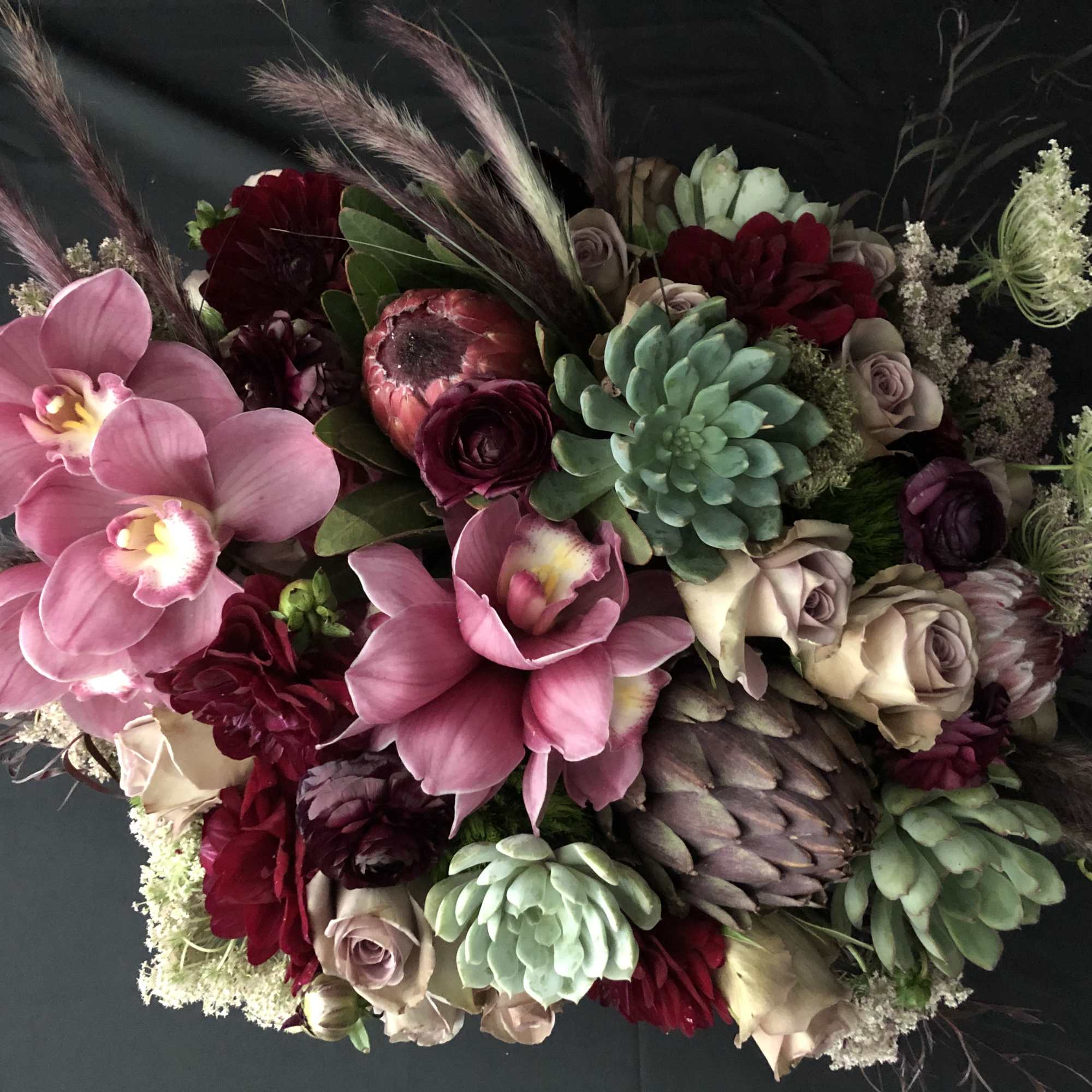 Succulents, roses, antique hydrangeas, scabiosas, anemones, ranunculus, kale and proteas just to, photo 3 of 4