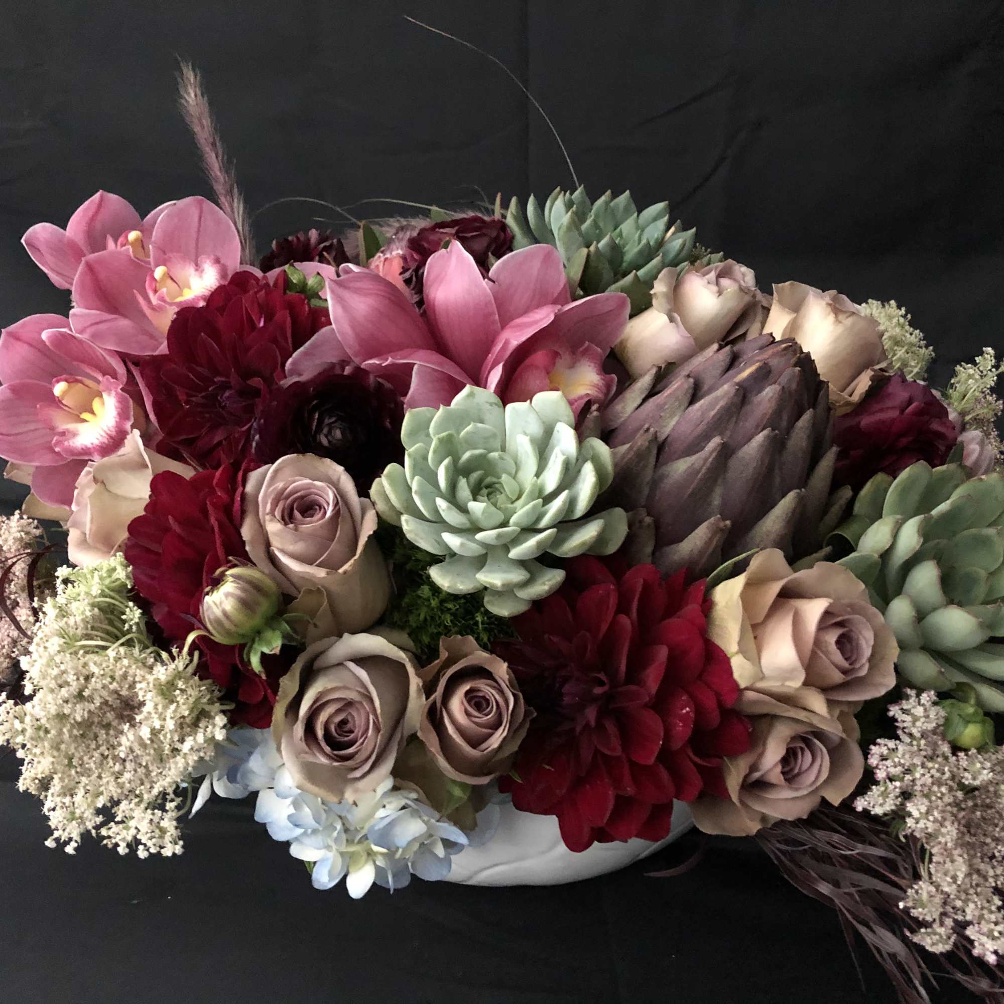 Succulents, roses, antique hydrangeas, scabiosas, anemones, ranunculus, kale and proteas just to, photo 4 of 4