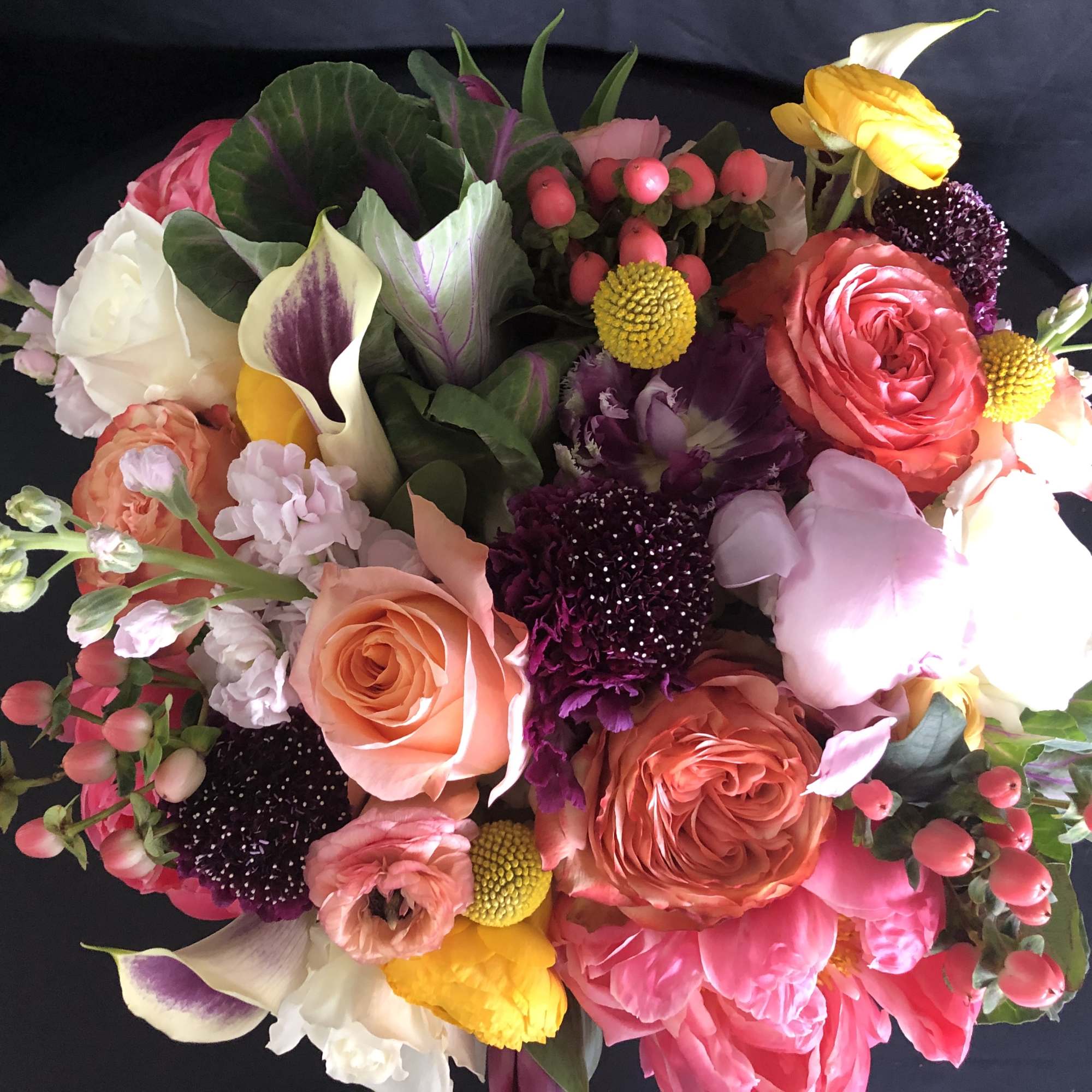 Mixed bouquet with pink, peach, white, and yellow flowers