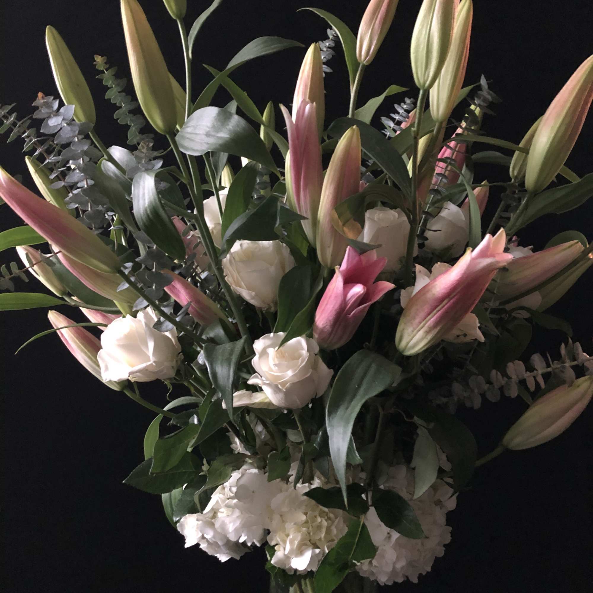 This tall arrangements is composed of white hydrangeas, roses and lilies.



We will, photo 5 of 5