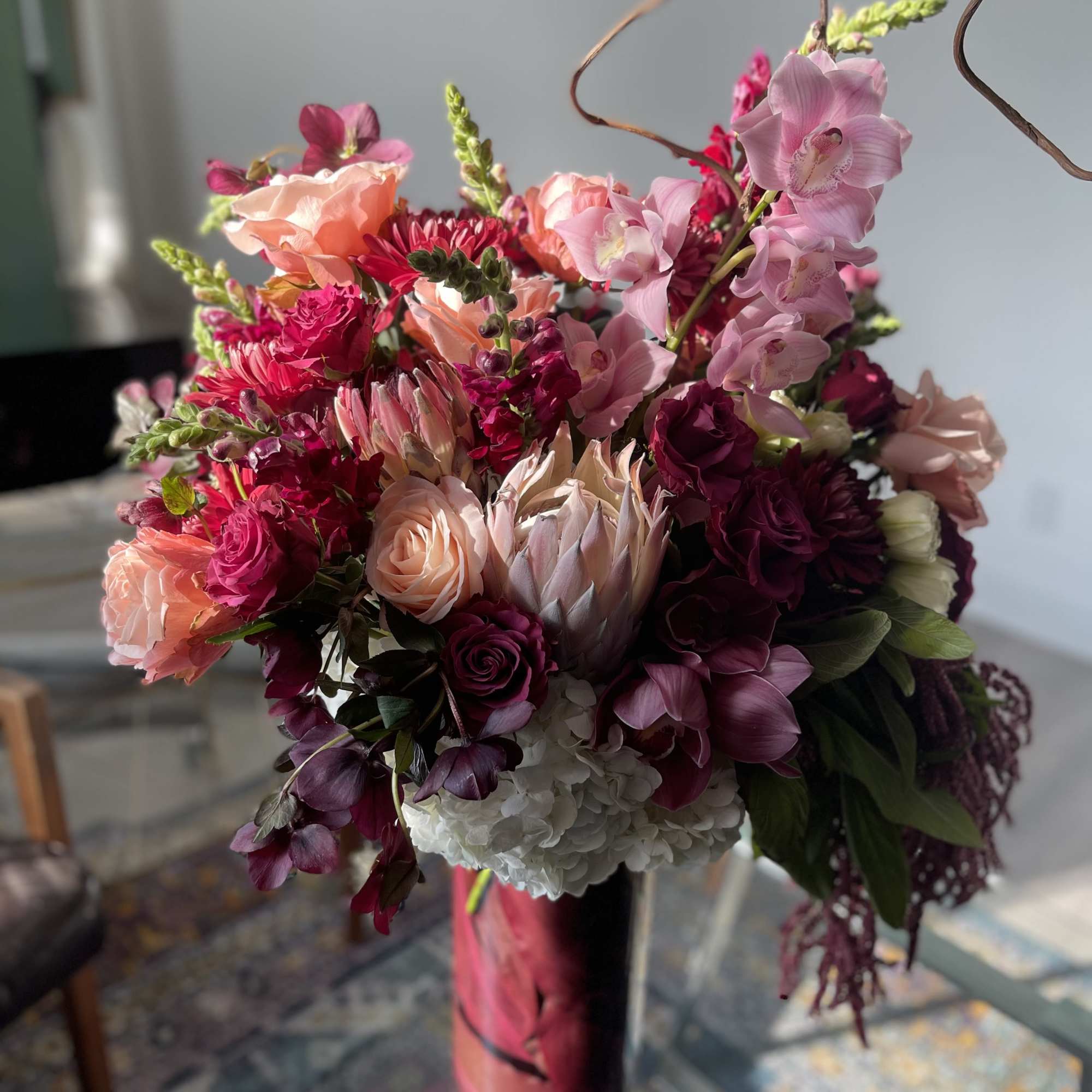 Filled with dahlias, orchids, protea, hydrangeas, tulips and roses, this design is, photo 3 of 6