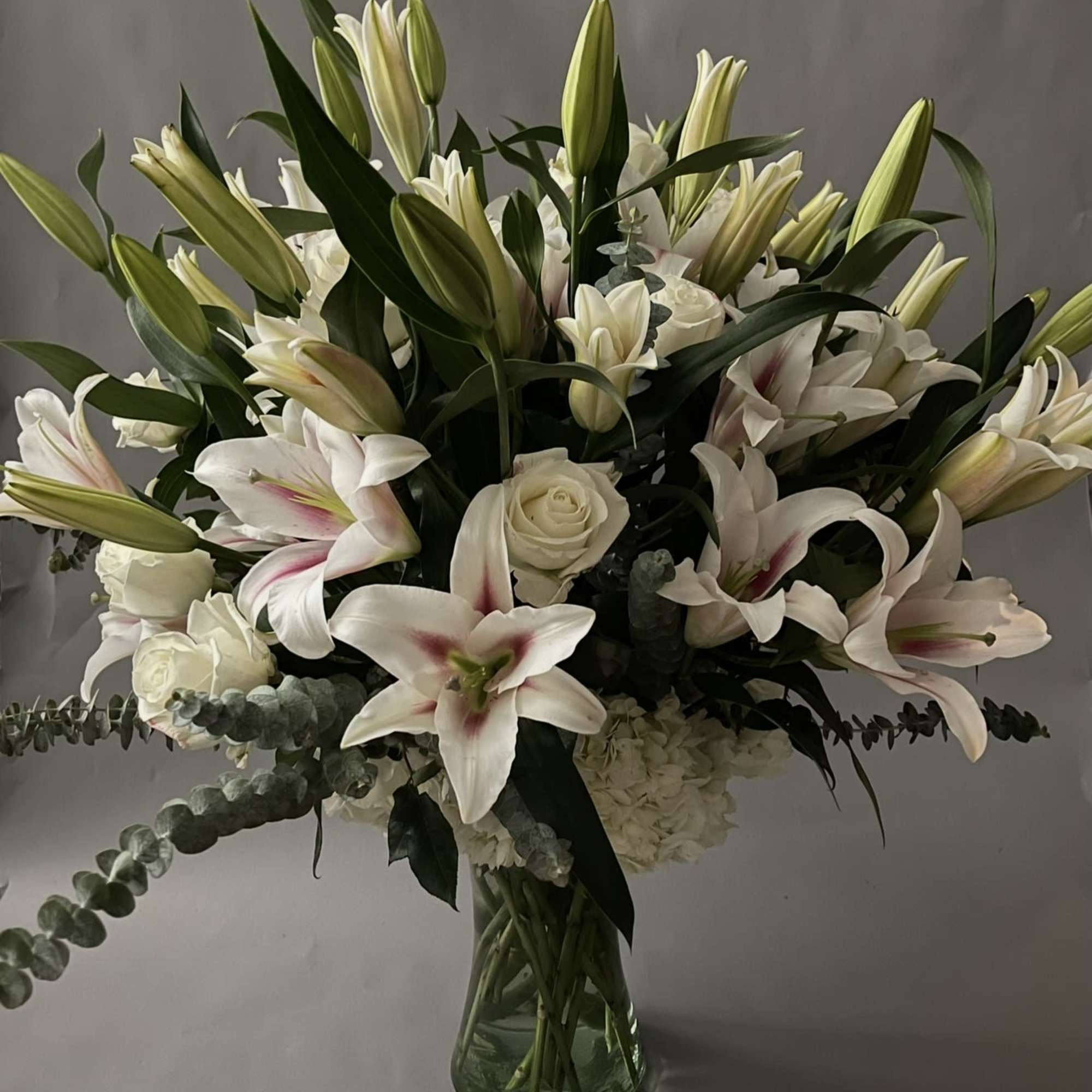 50 setms of lilies with 2 dozen white roses. 