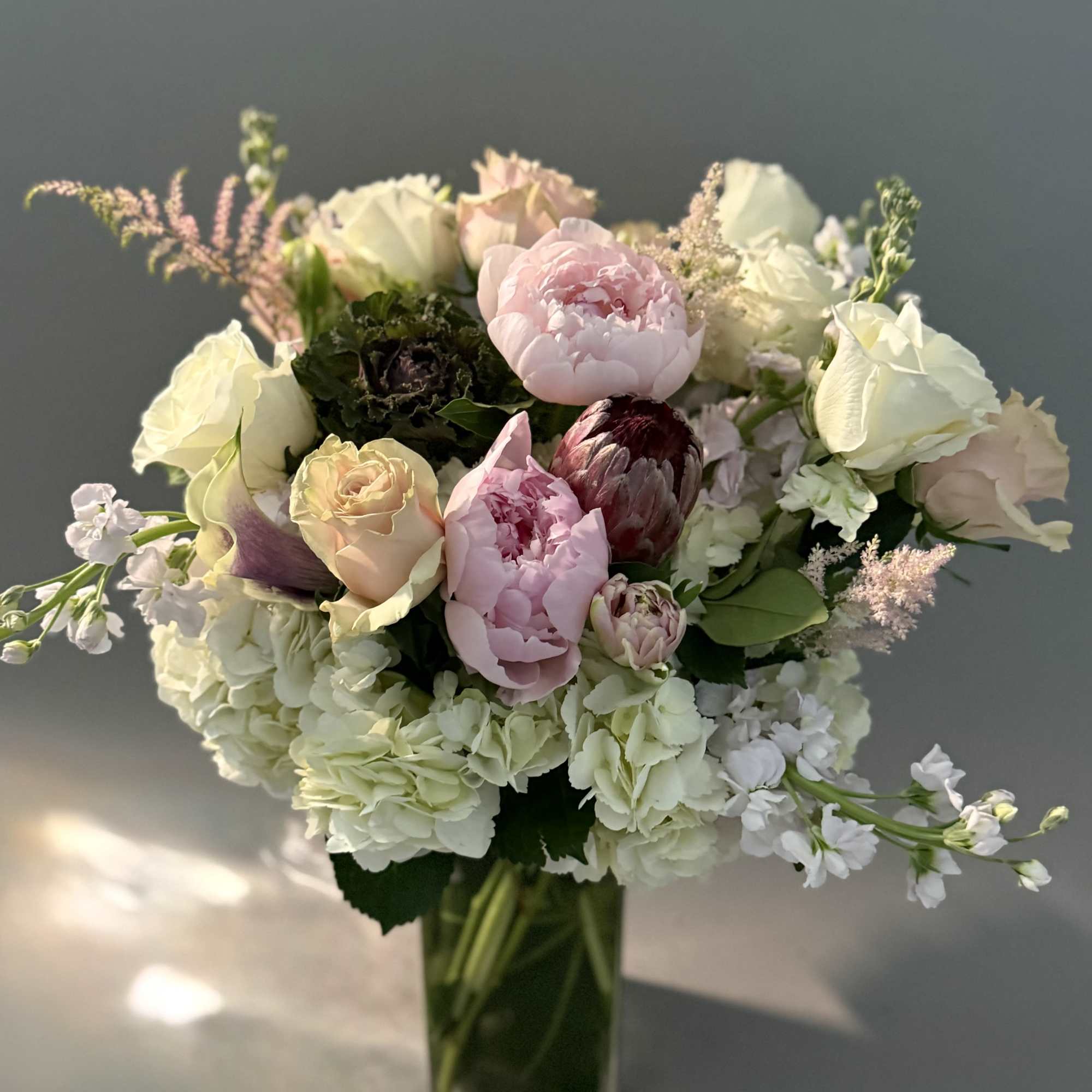 ***No specific delivery time available***
Peony and Calla color may vary without compromising