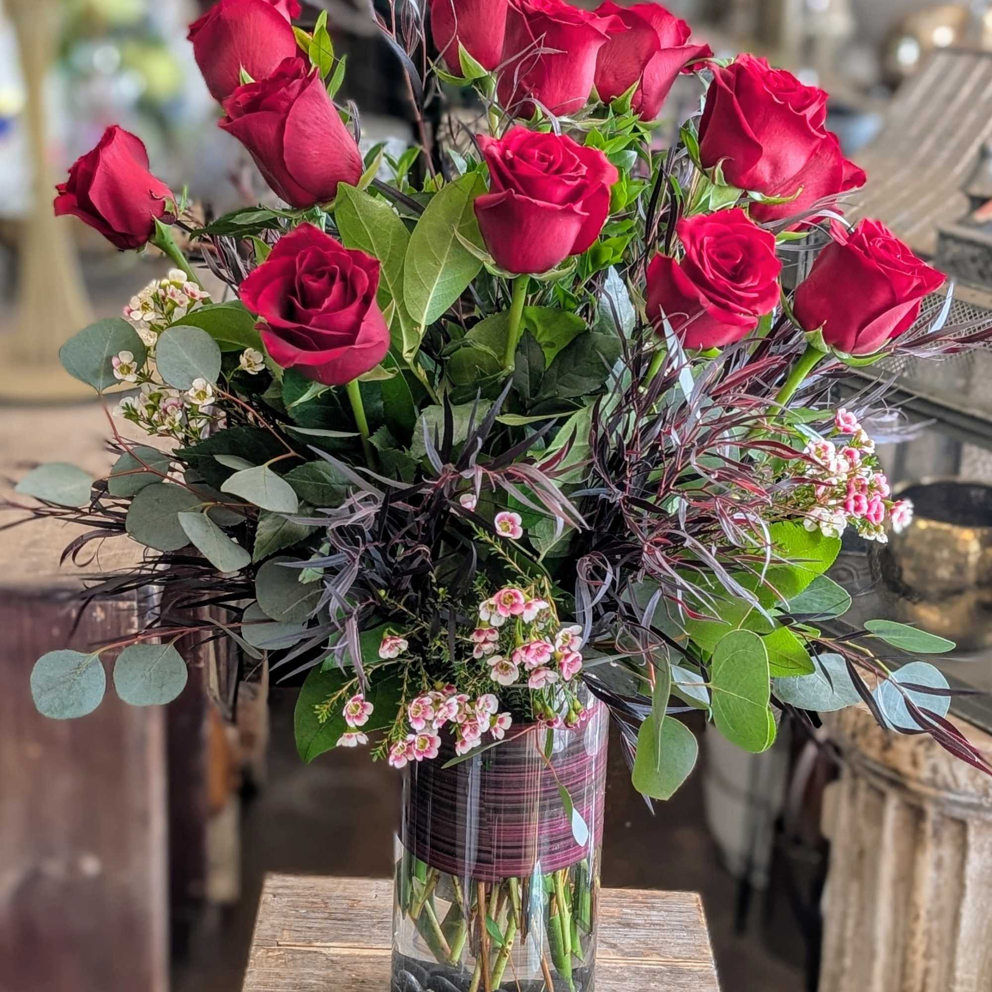Bouquet of red roses in a clear glass vase