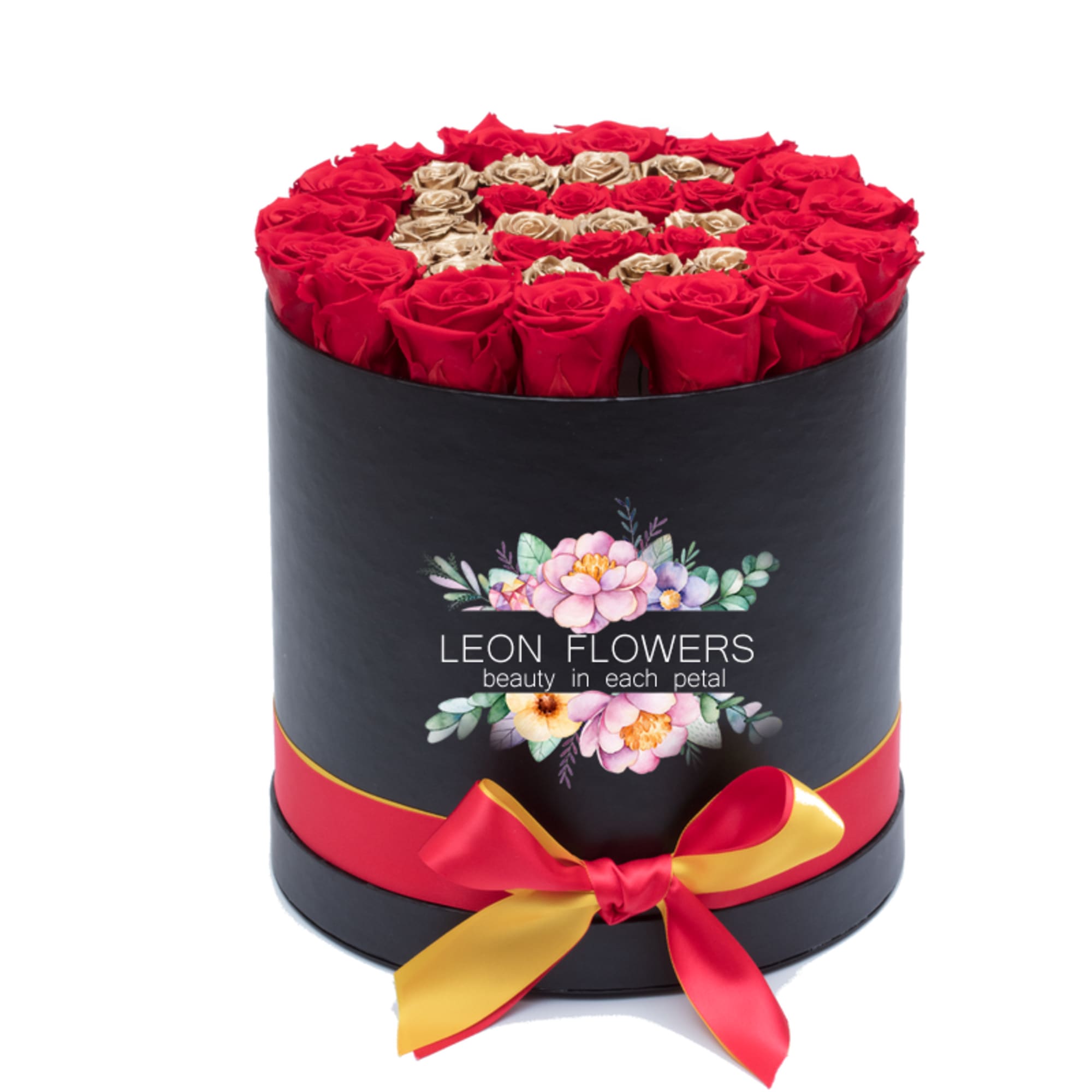 Round box of red and gold roses with a ribbon bow
