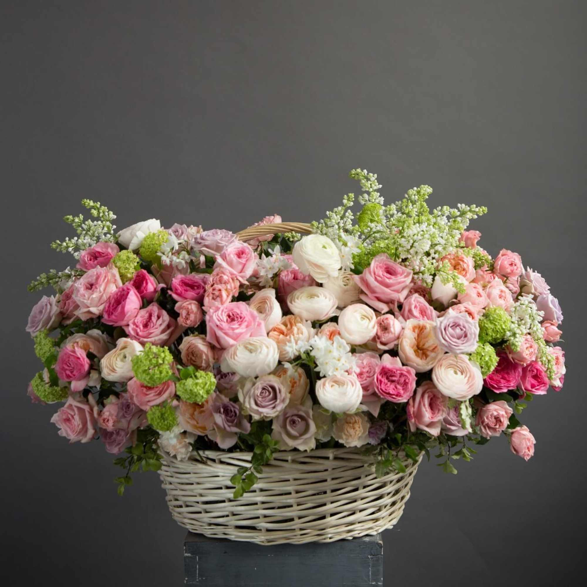 Basket of pink and white roses with green accents, photo 6 of 6