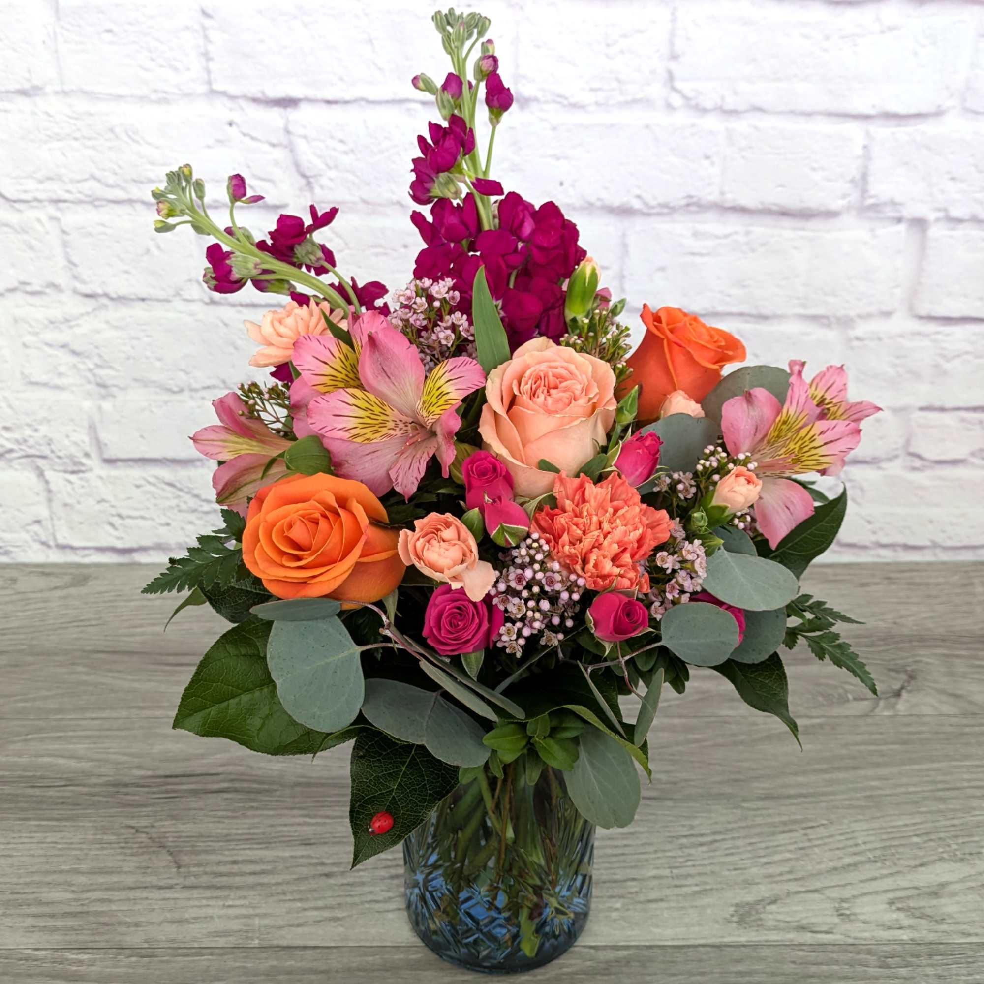 Peach Harvest is A Ladybug Floral exclusive bouquet. This bouquet stock roses