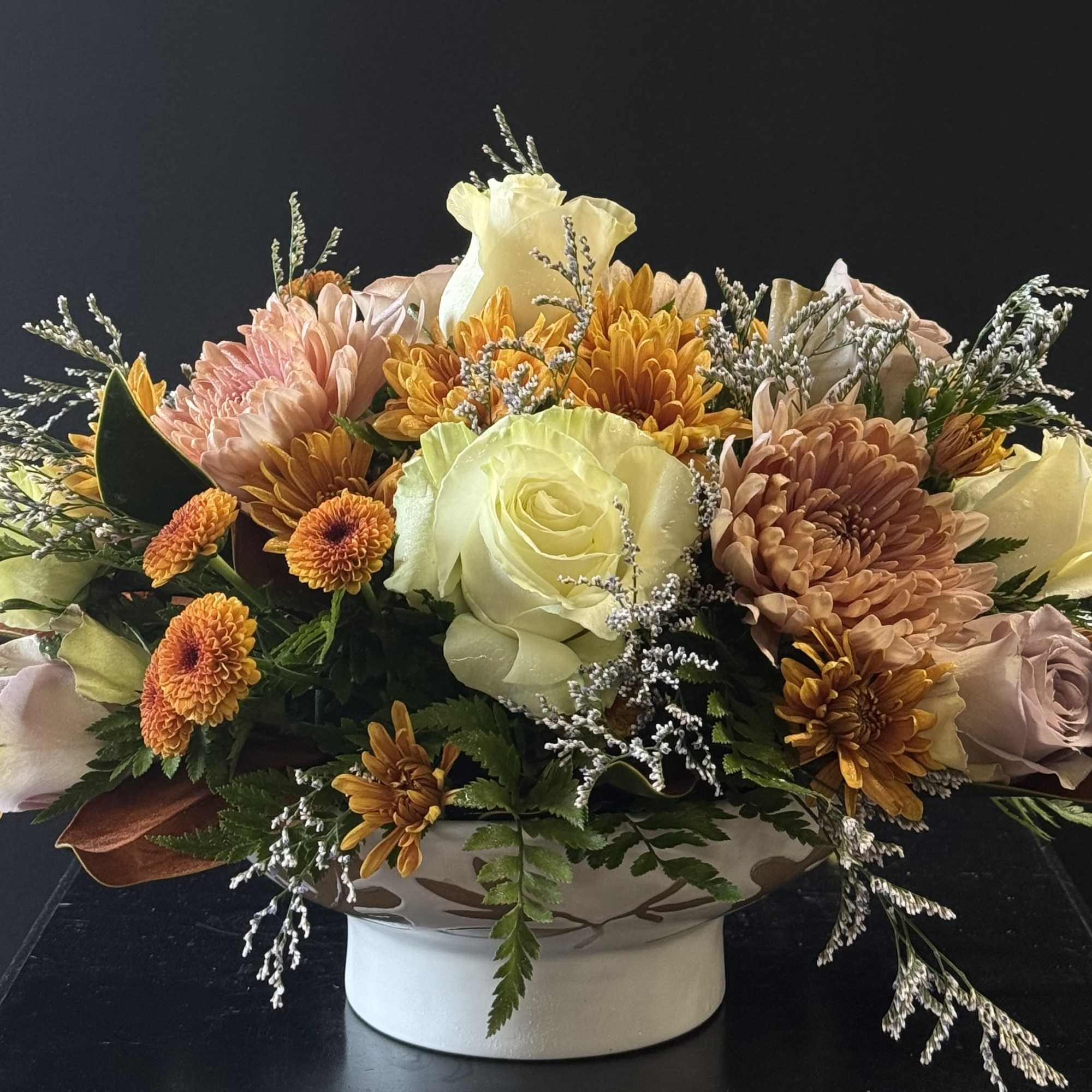 An inviting arrangement filled with blooms in spiced tones, perfect for setting, photo 2 of 2
