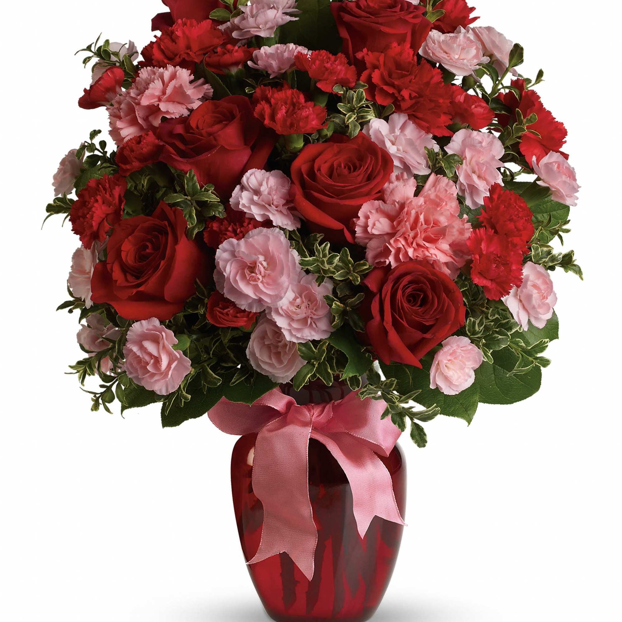 Red roses and pink carnations in a red vase with a pink ribbon