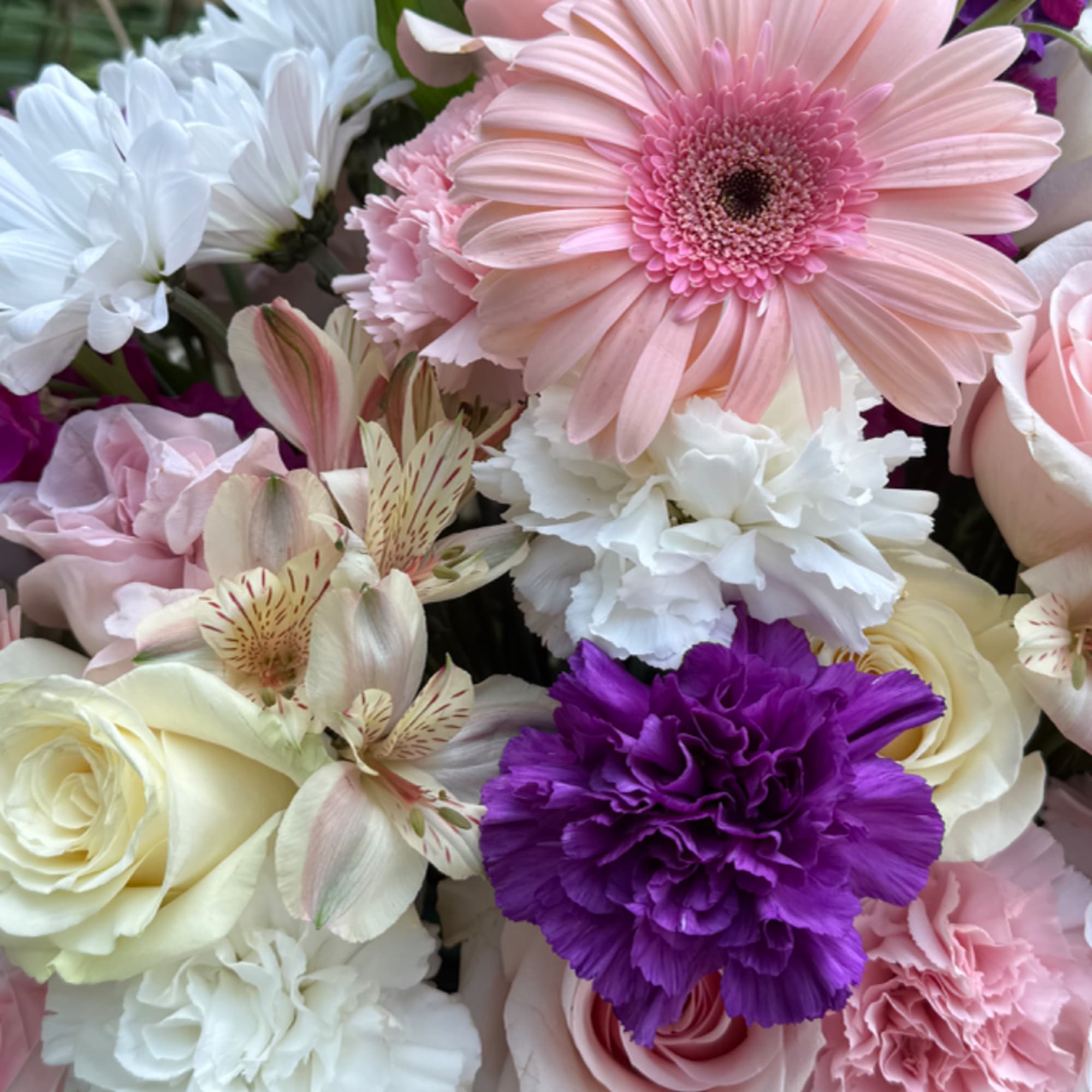 Mixed bouquet with pink, white, and purple flowers