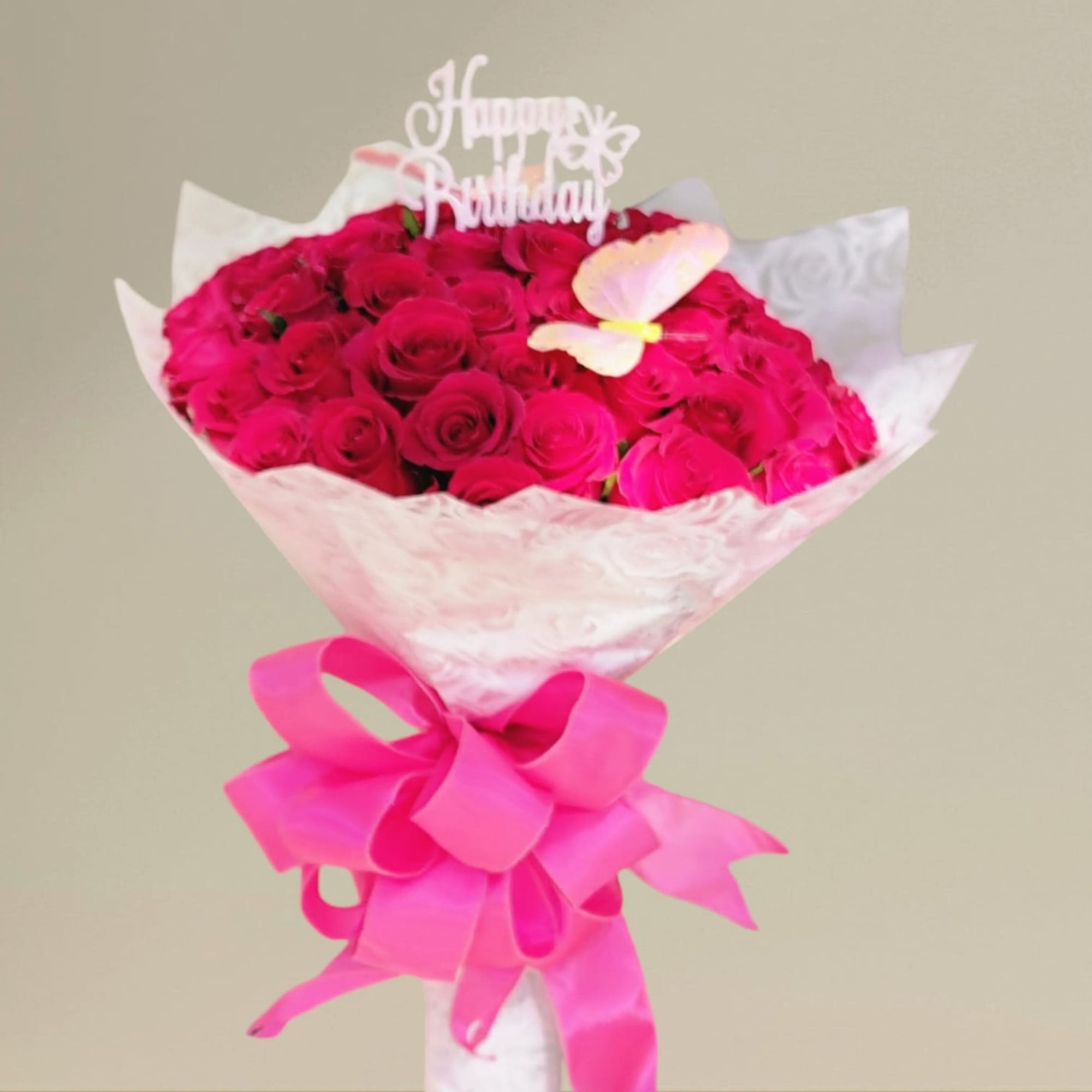 Bouquet of hot pink roses with a birthday topper and ribbon
