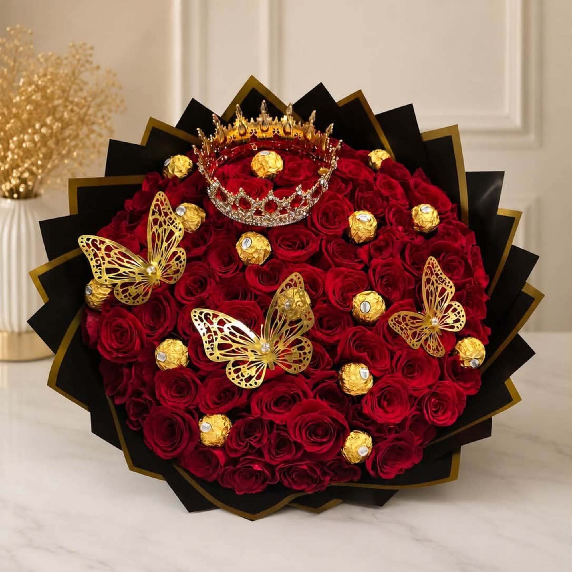 Red rose bouquet with gold butterflies and chocolates
