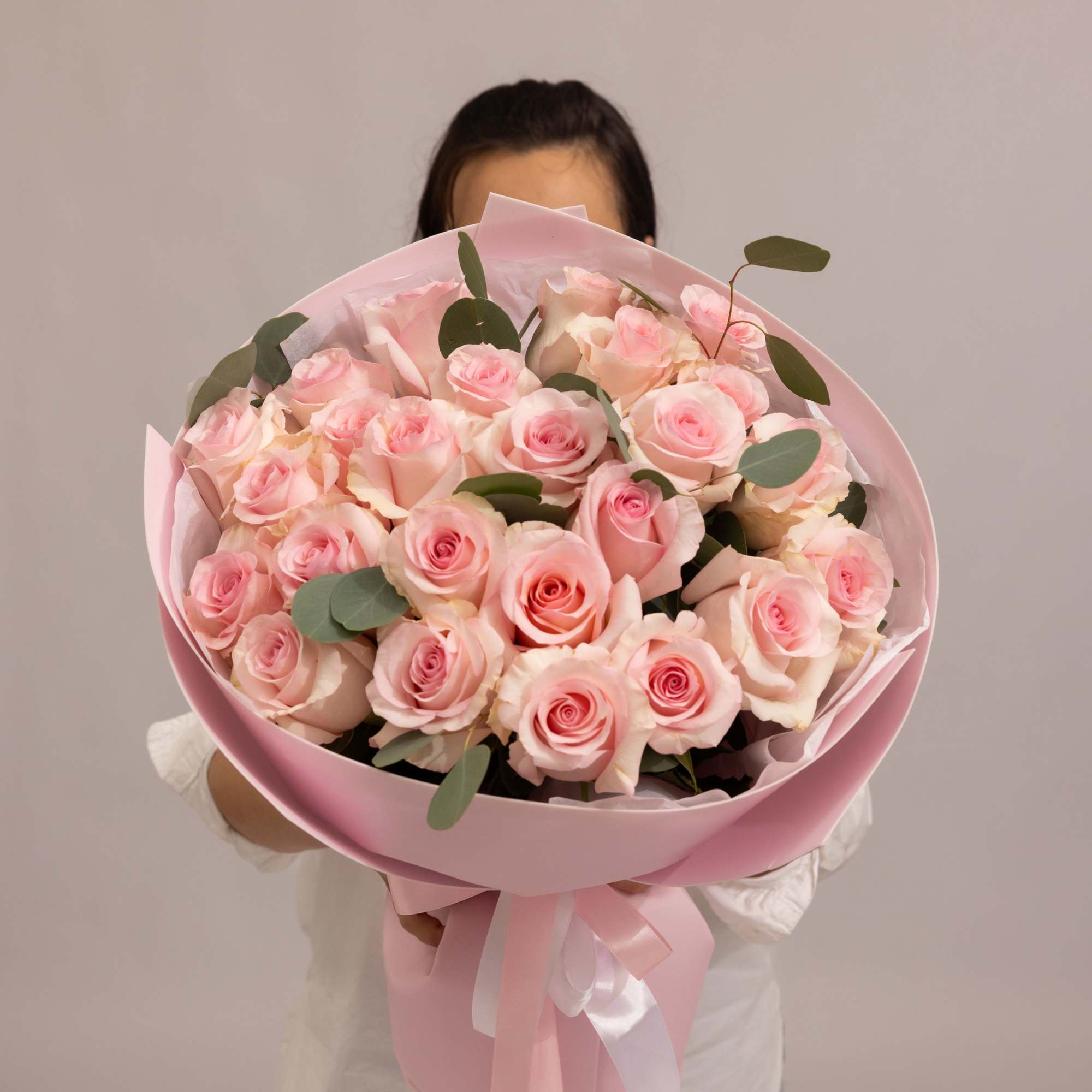 A delicate bouquet of  premium roses in soft blush pink tones.