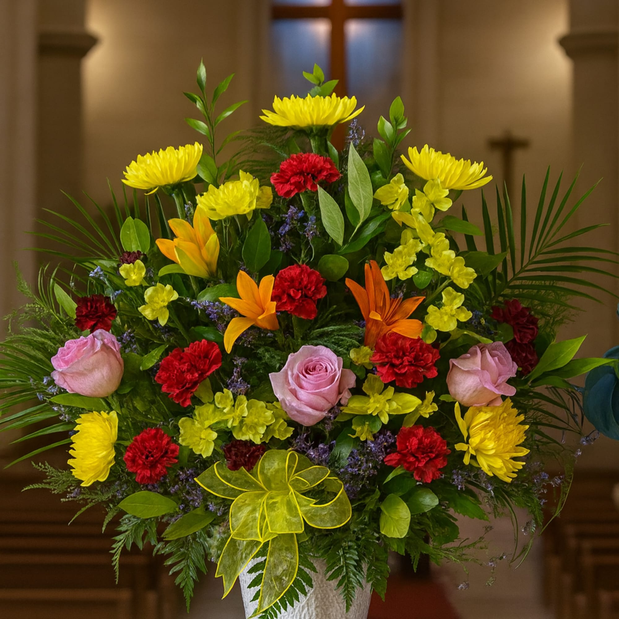 Colorful flower arrangement in a white vase