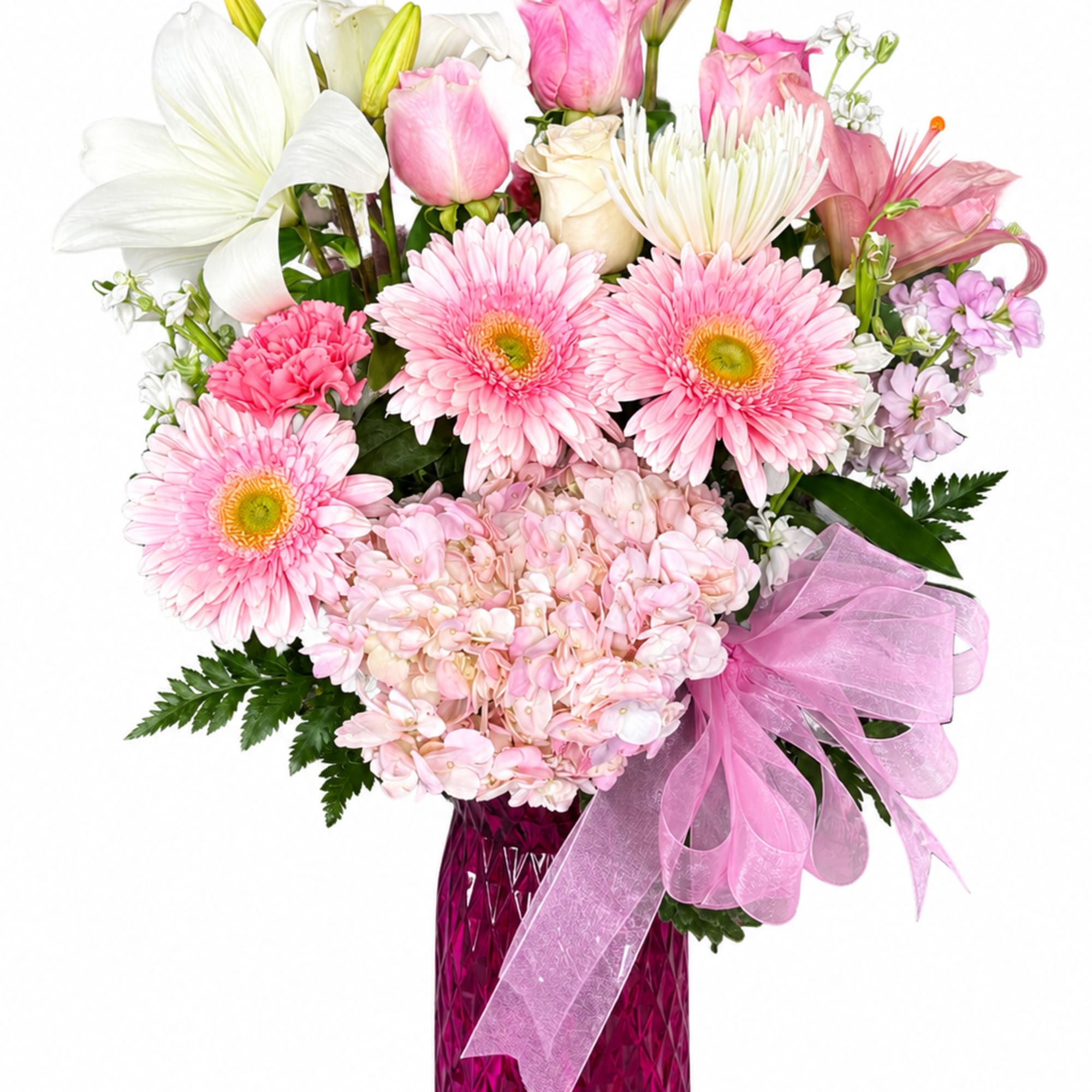 Pink and white mixed bouquet in a magenta vase with a pink ribbon