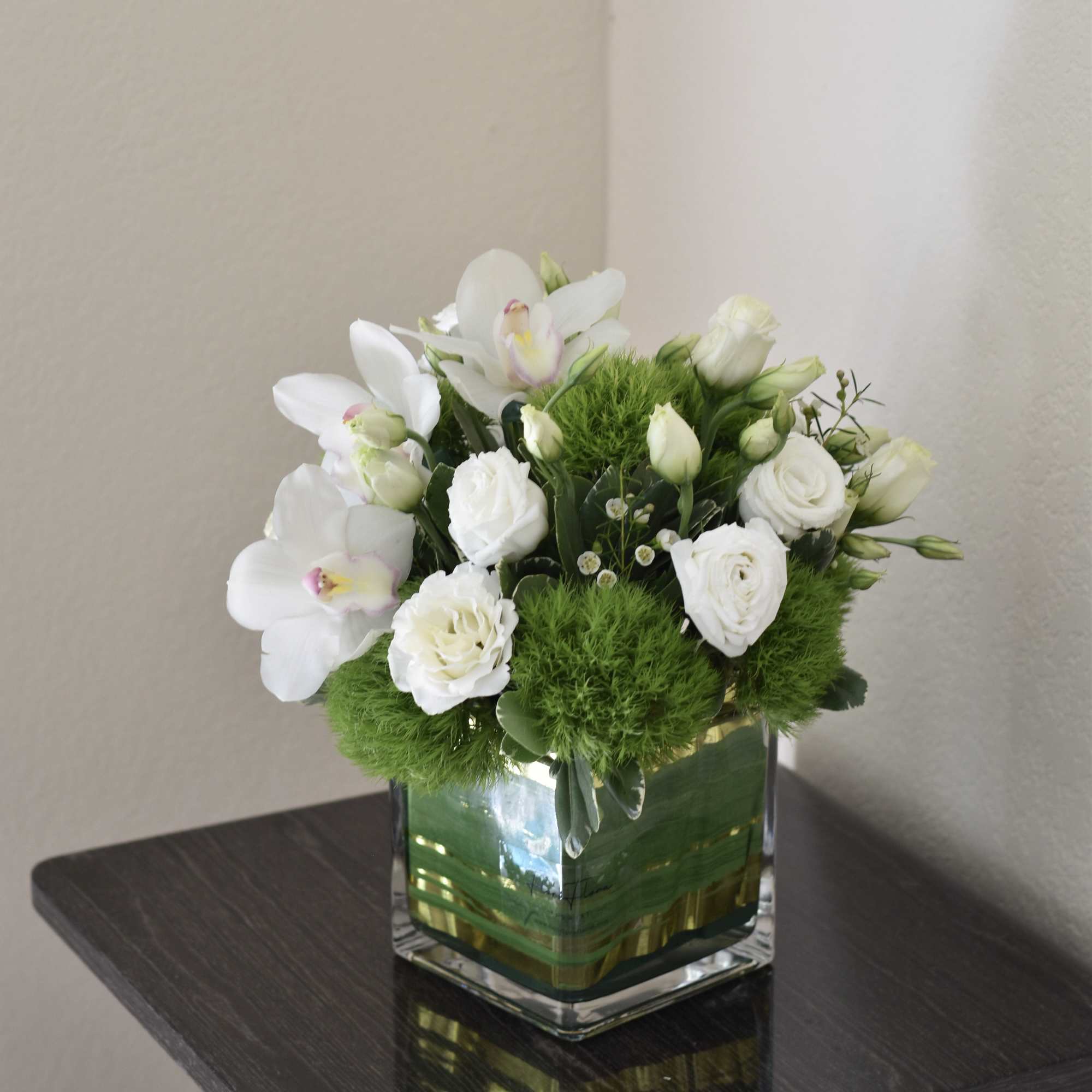 "Something Grace" is an elegant and timeless flower arrangement that radiates pure