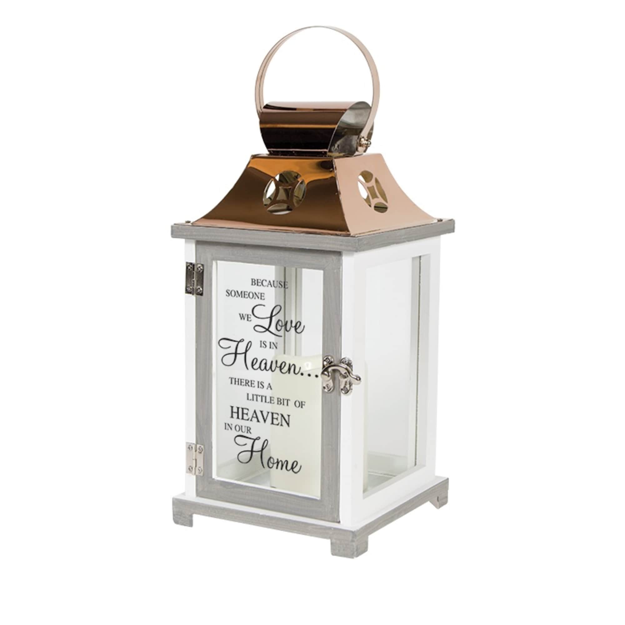 Decorative white lantern with a memorial quote on the front