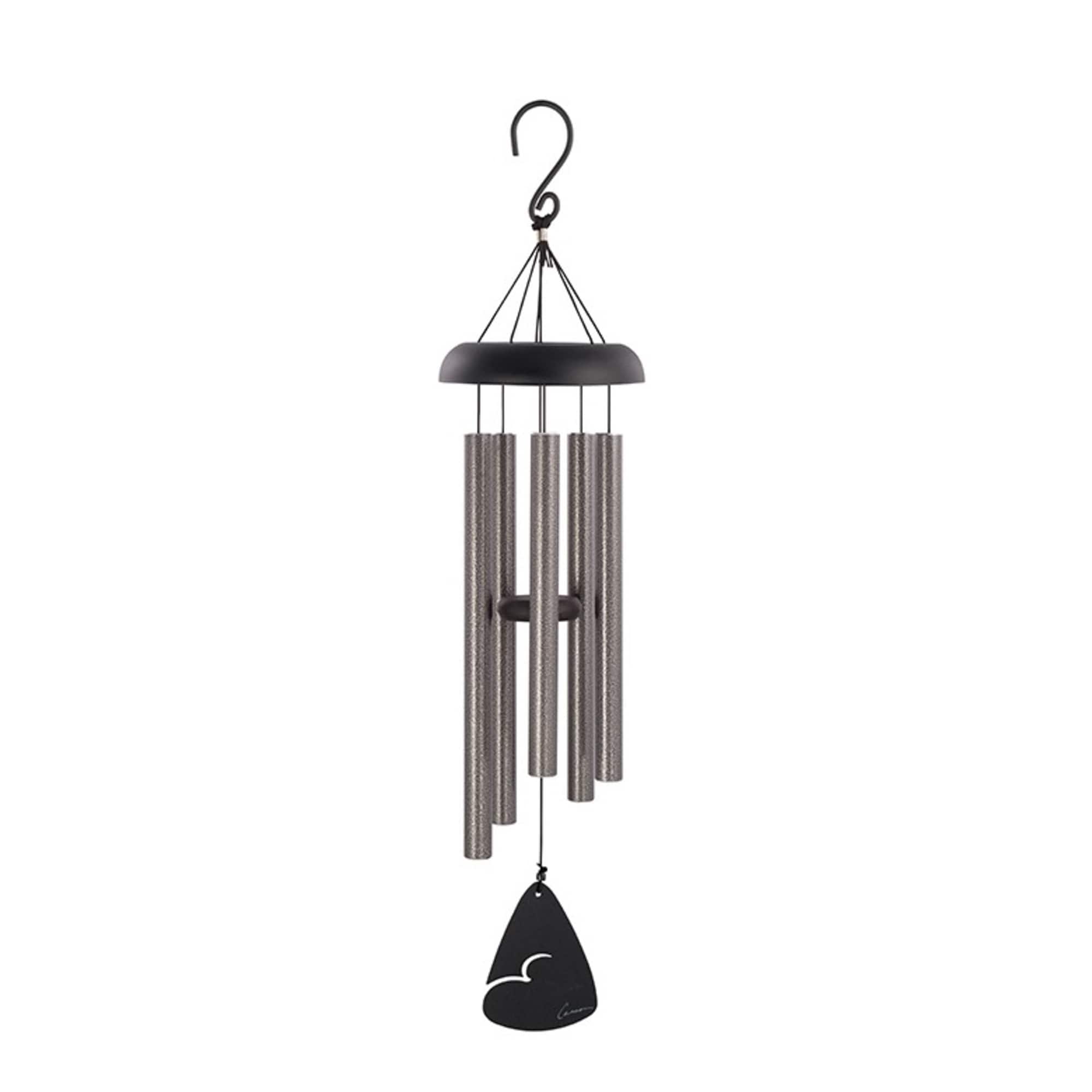 Black and silver wind chime hanging on a white background