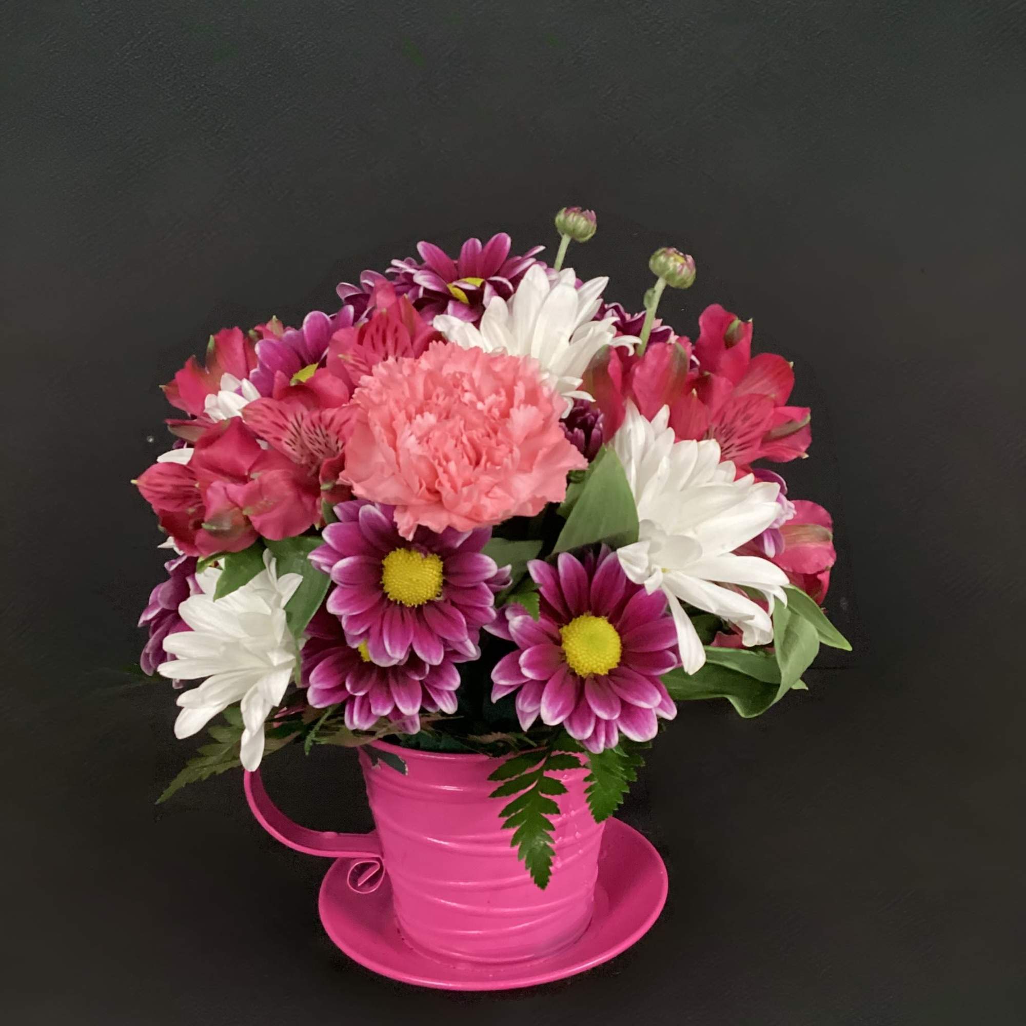 This cute metal teacup comes in several colors (Green, Purple, Orange, Red