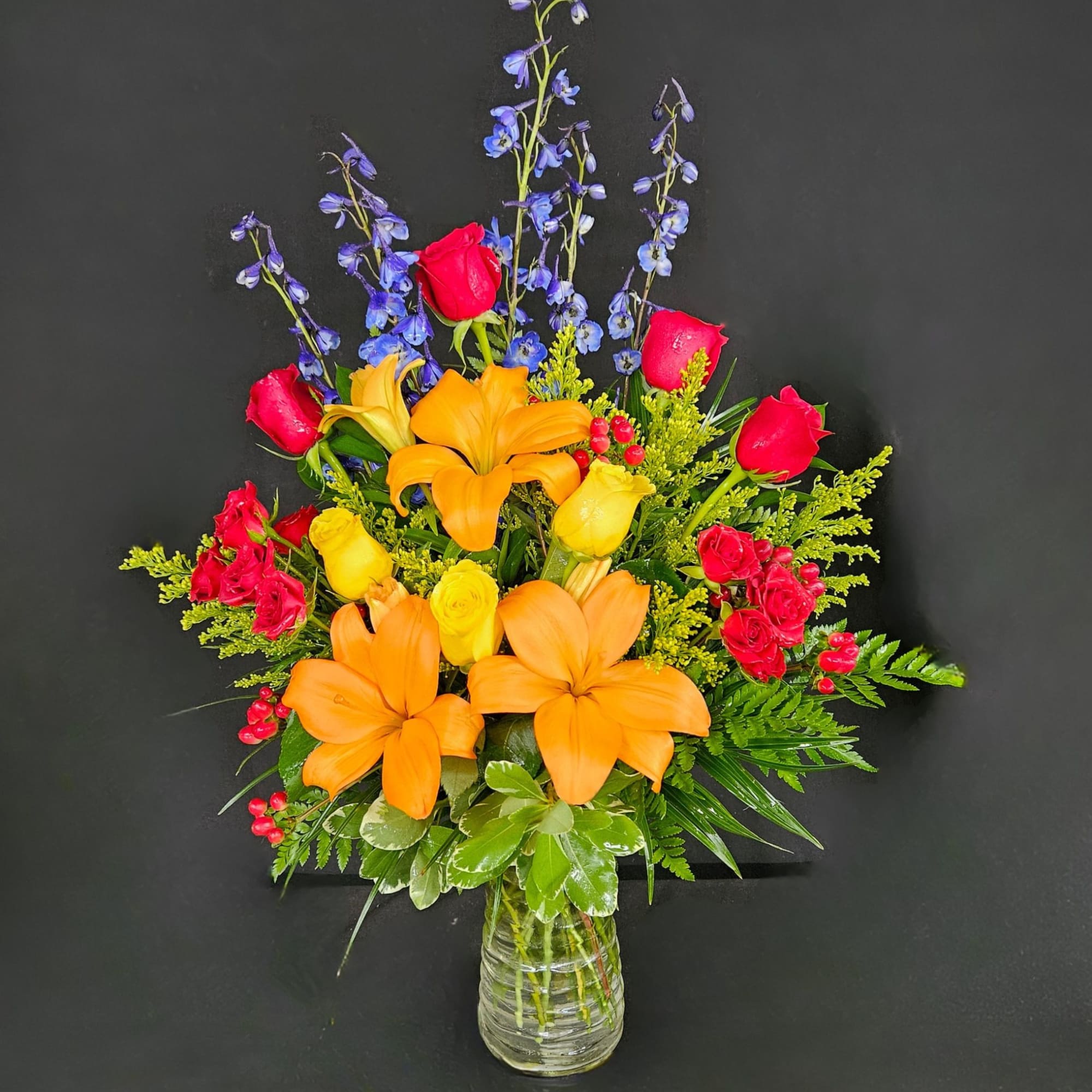 A full rainbow of colors in this arrangement makes it a perfect