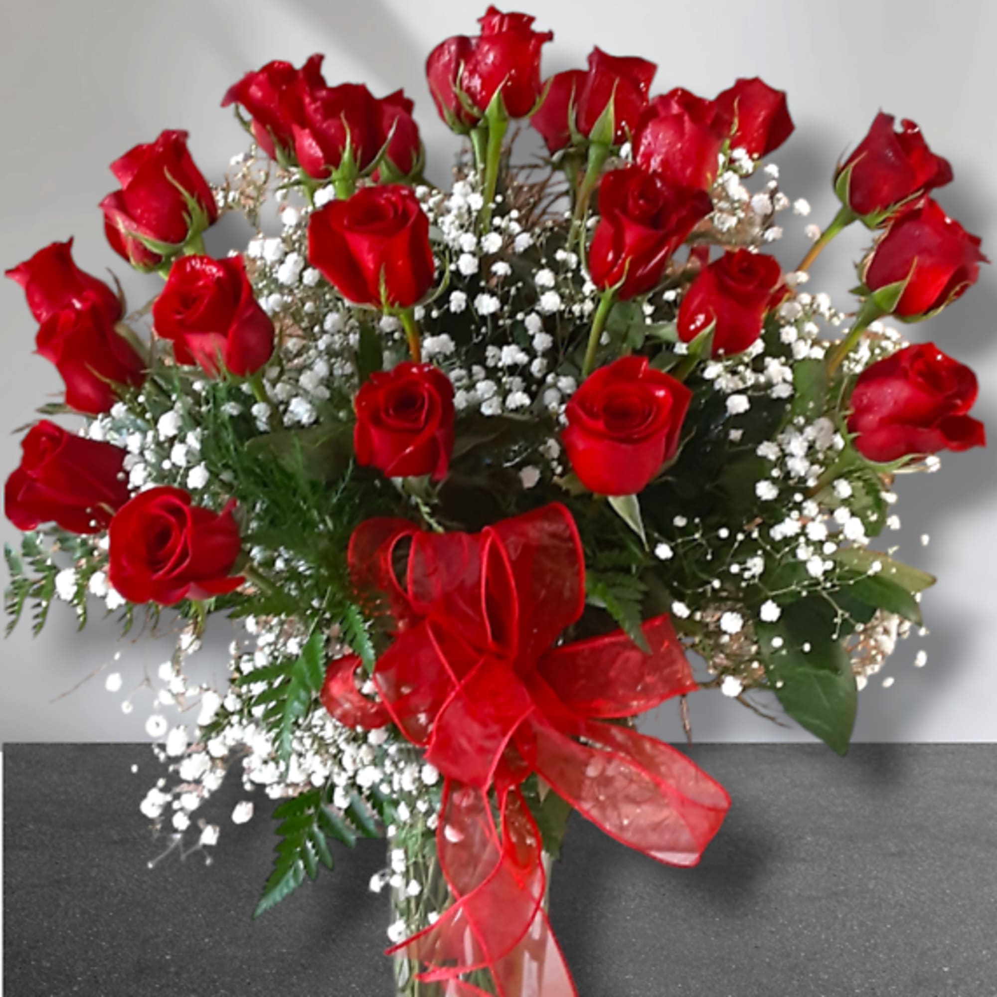 Timeless and romantic, this classic dozen of long-stemmed premium roses is the