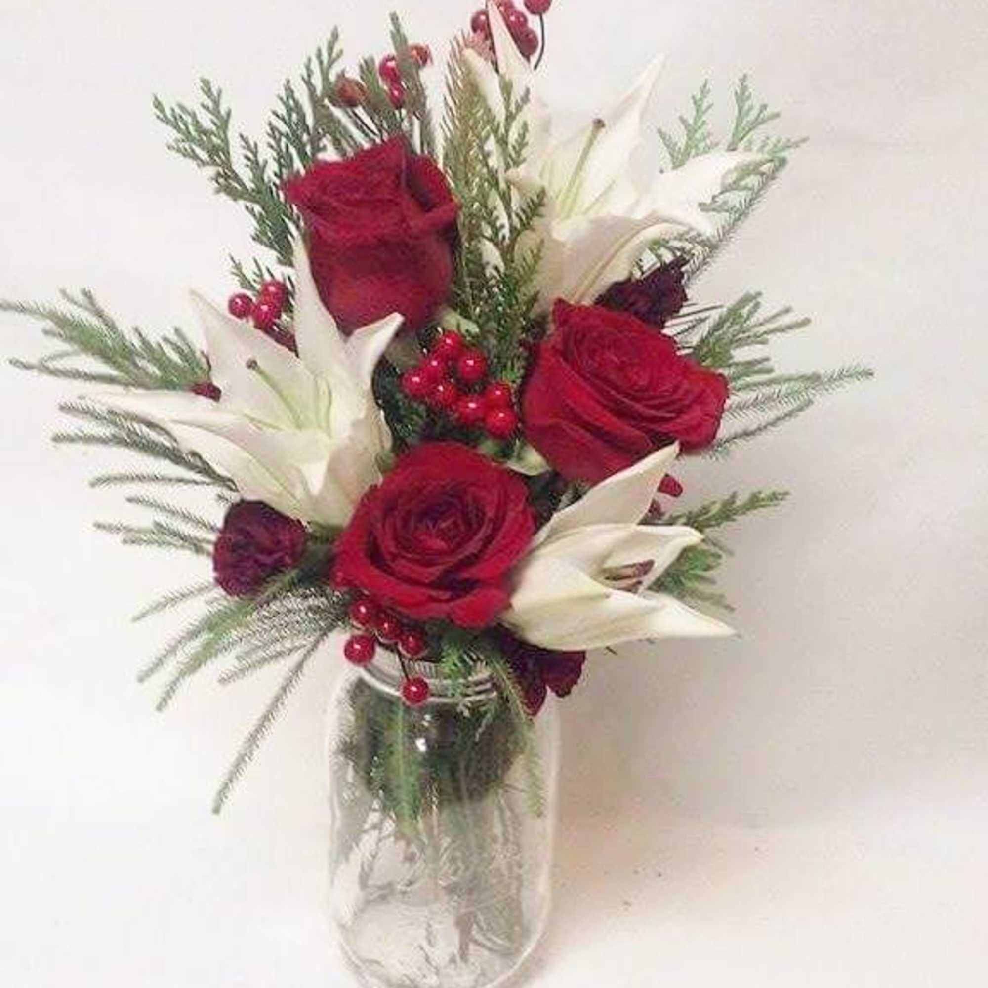Premium red roses, Oriental lillies and festive decor in a mason jar