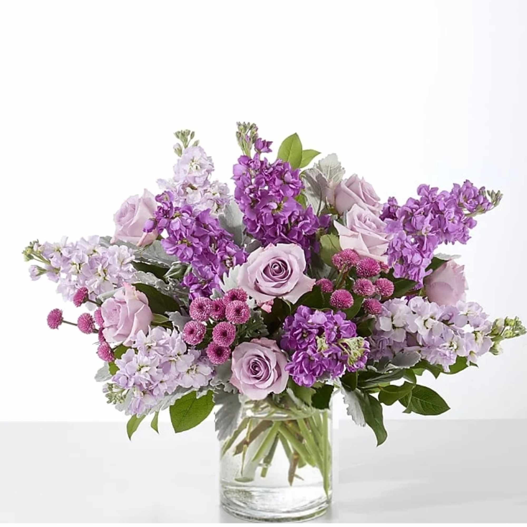 Lavender and purple bouquet in a clear glass vase