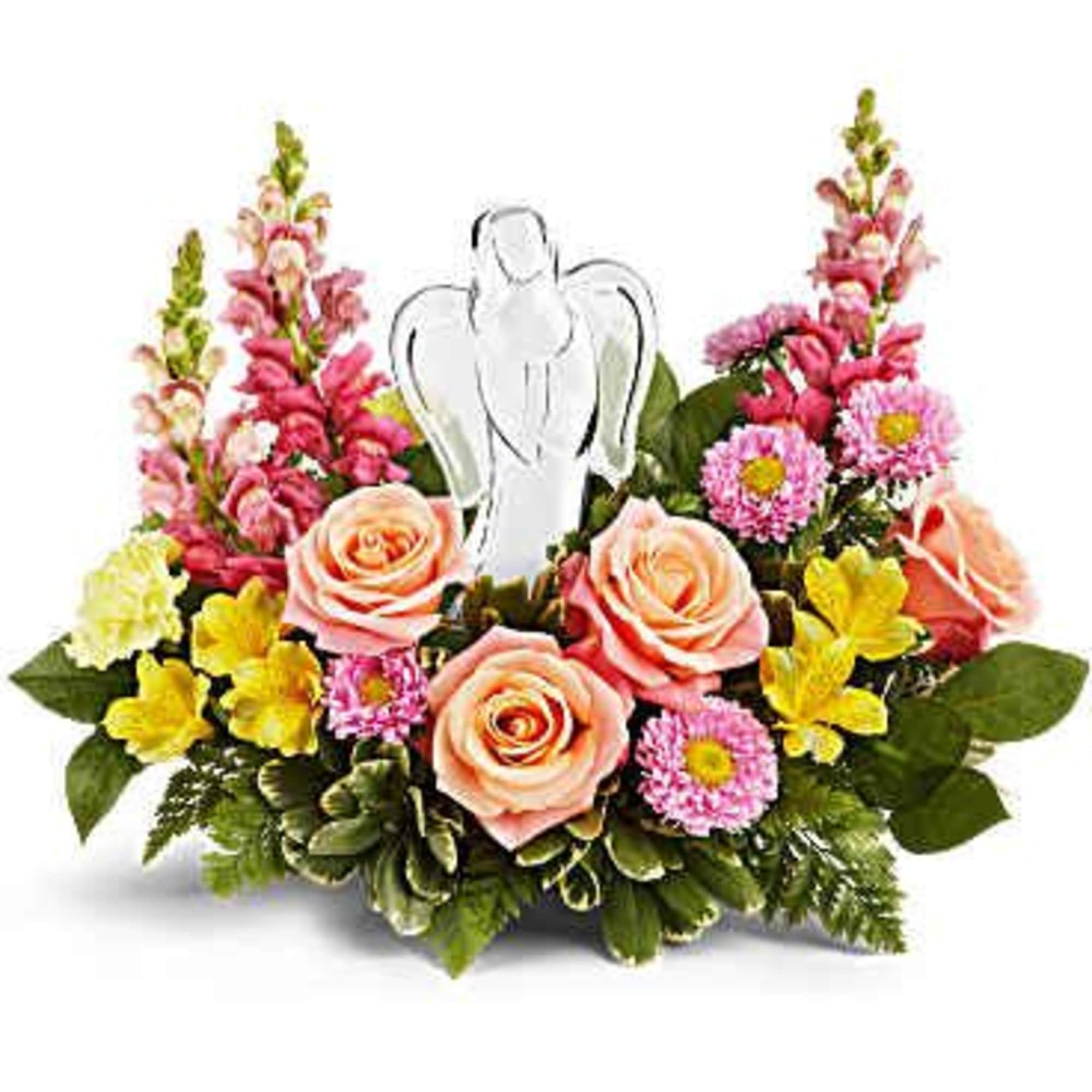 Pink and peach floral arrangement with a white angel pick