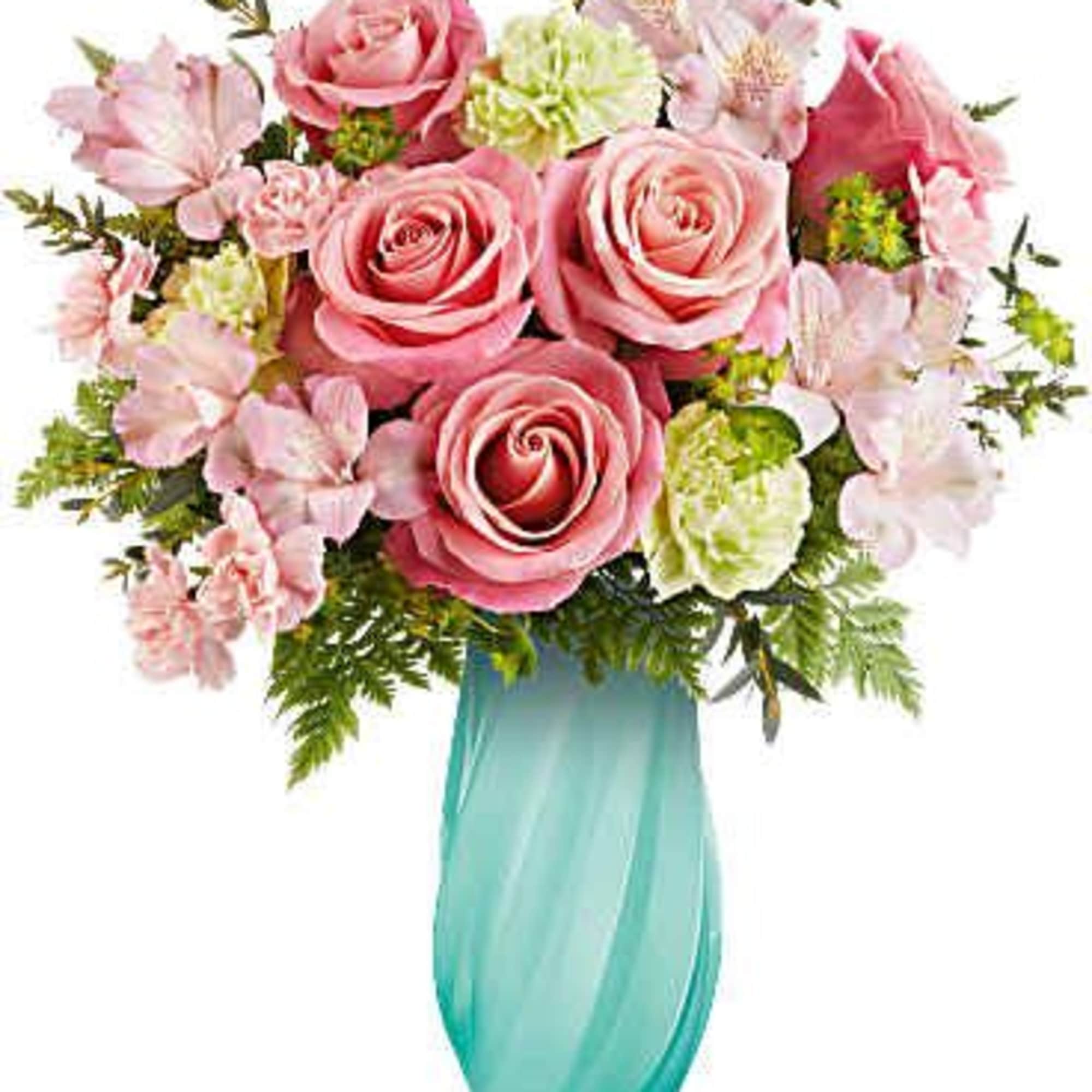 Pink roses and pale flowers in a turquoise vase