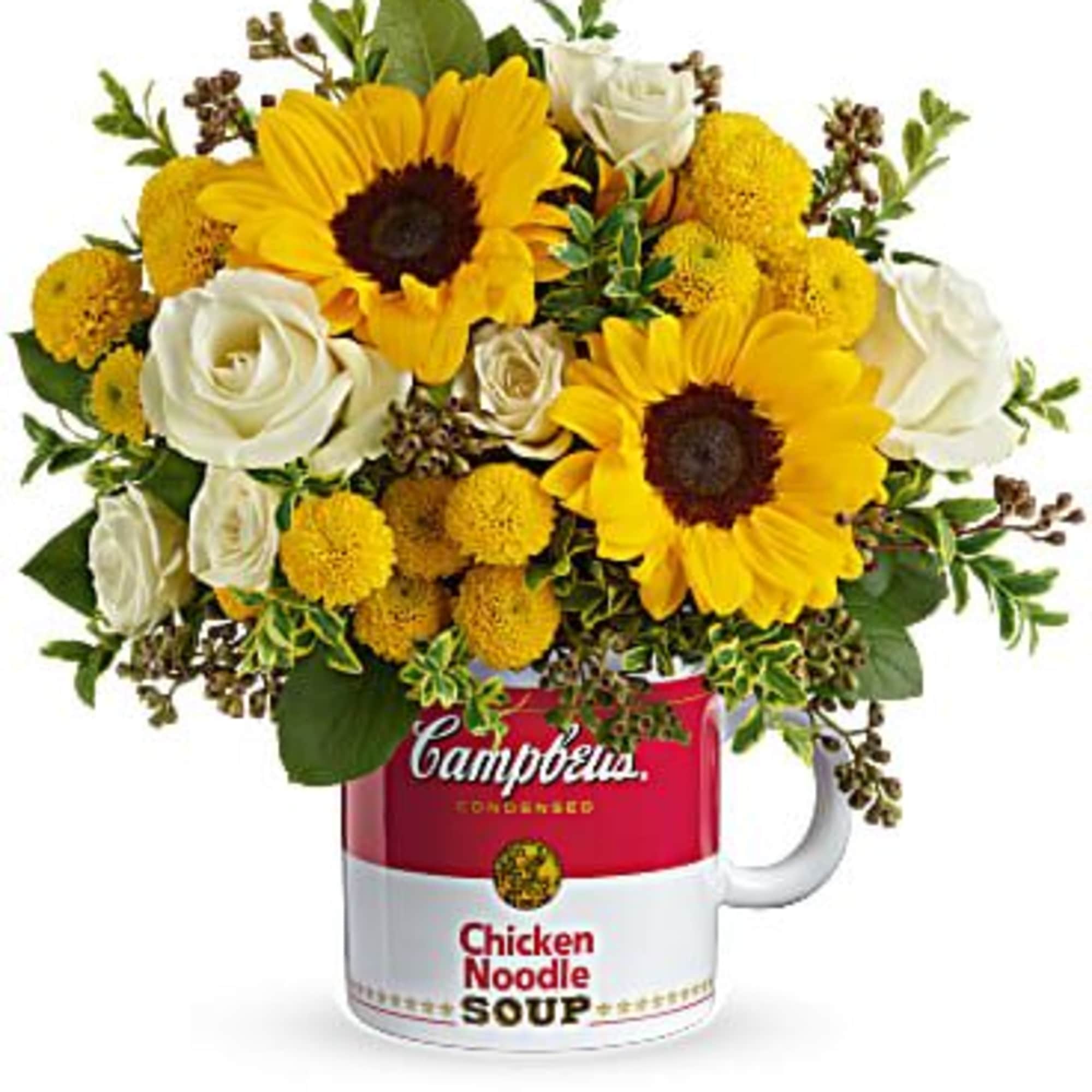 Bouquet of sunflowers and white roses in a Campbell's soup mug