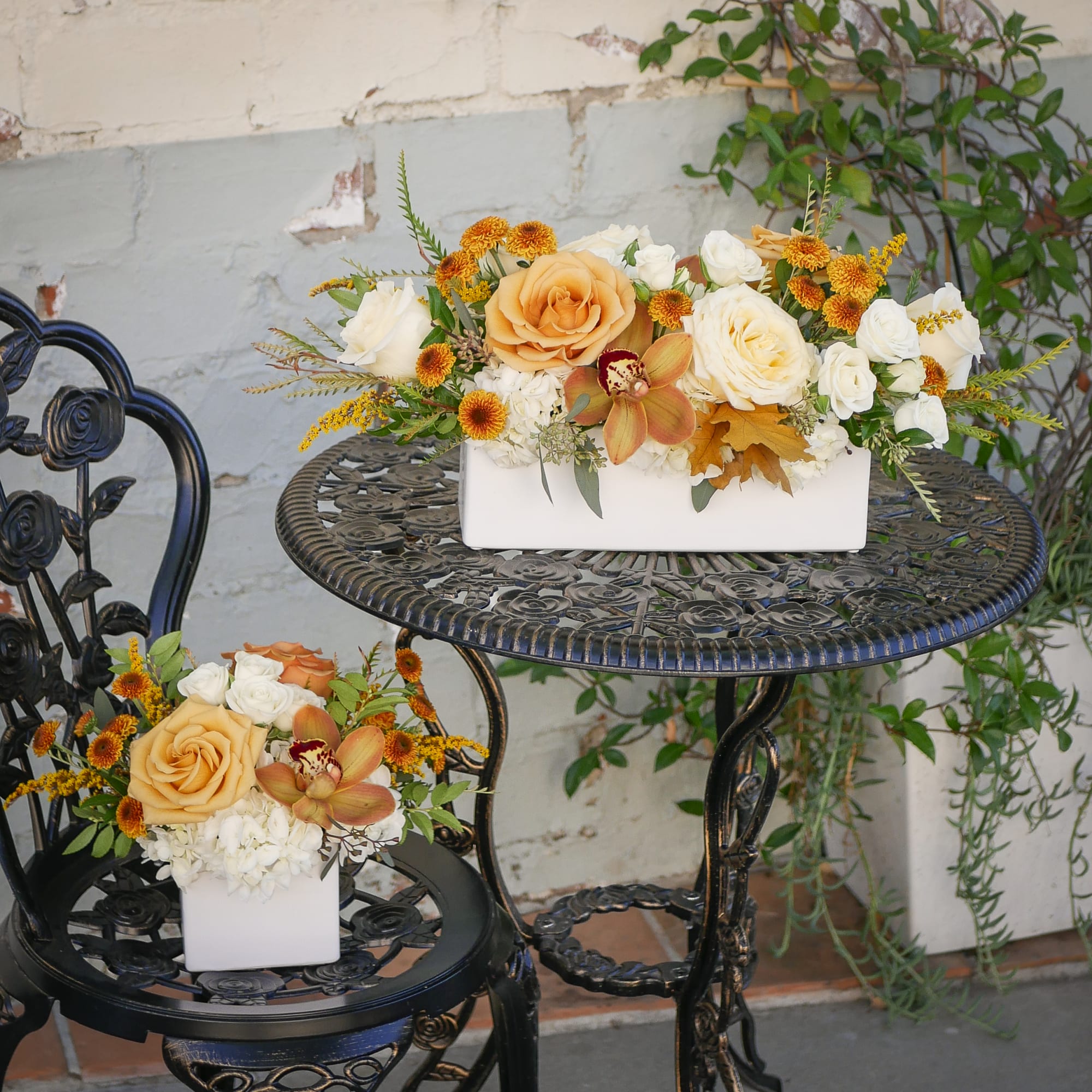 This petite Thanksgiving flower arrangement features soft cream roses and vibrant golden, photo 2 of 3