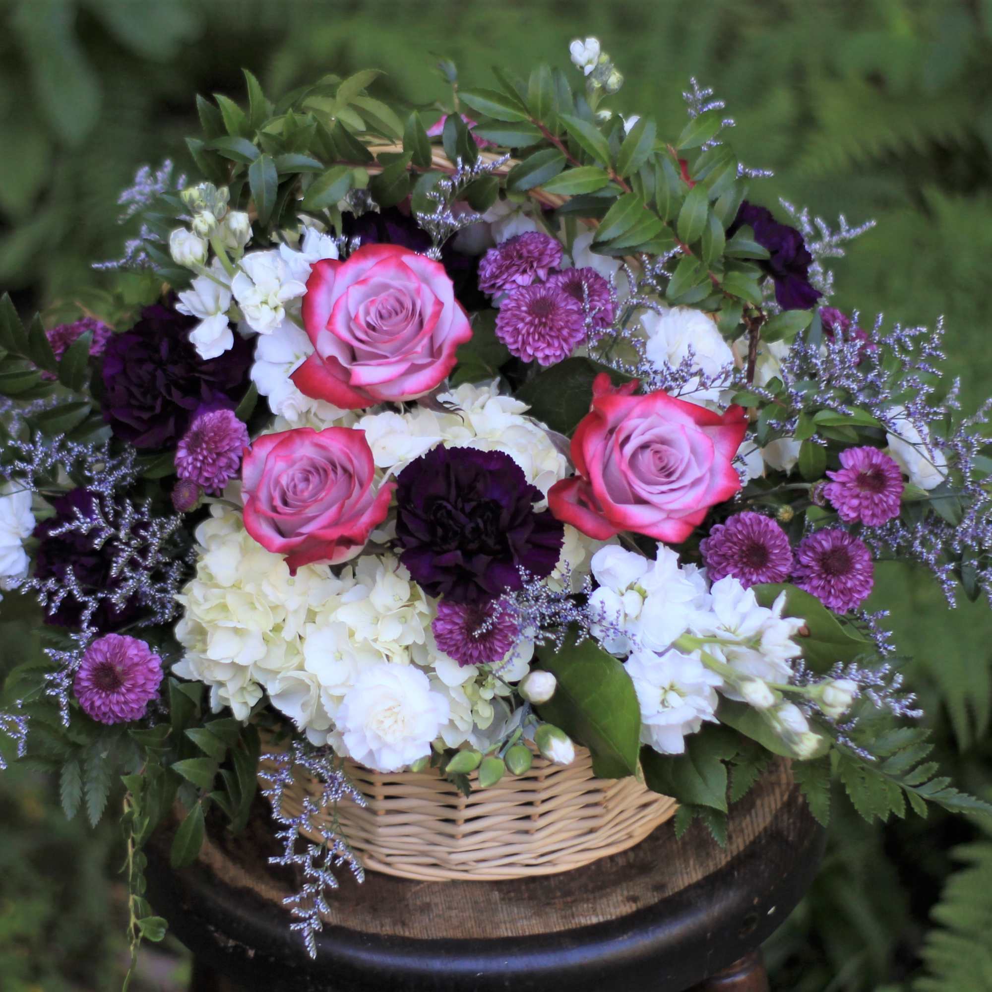Basket arrangement of pink roses, white hydrangeas, and purple flowers, photo 3 of 3