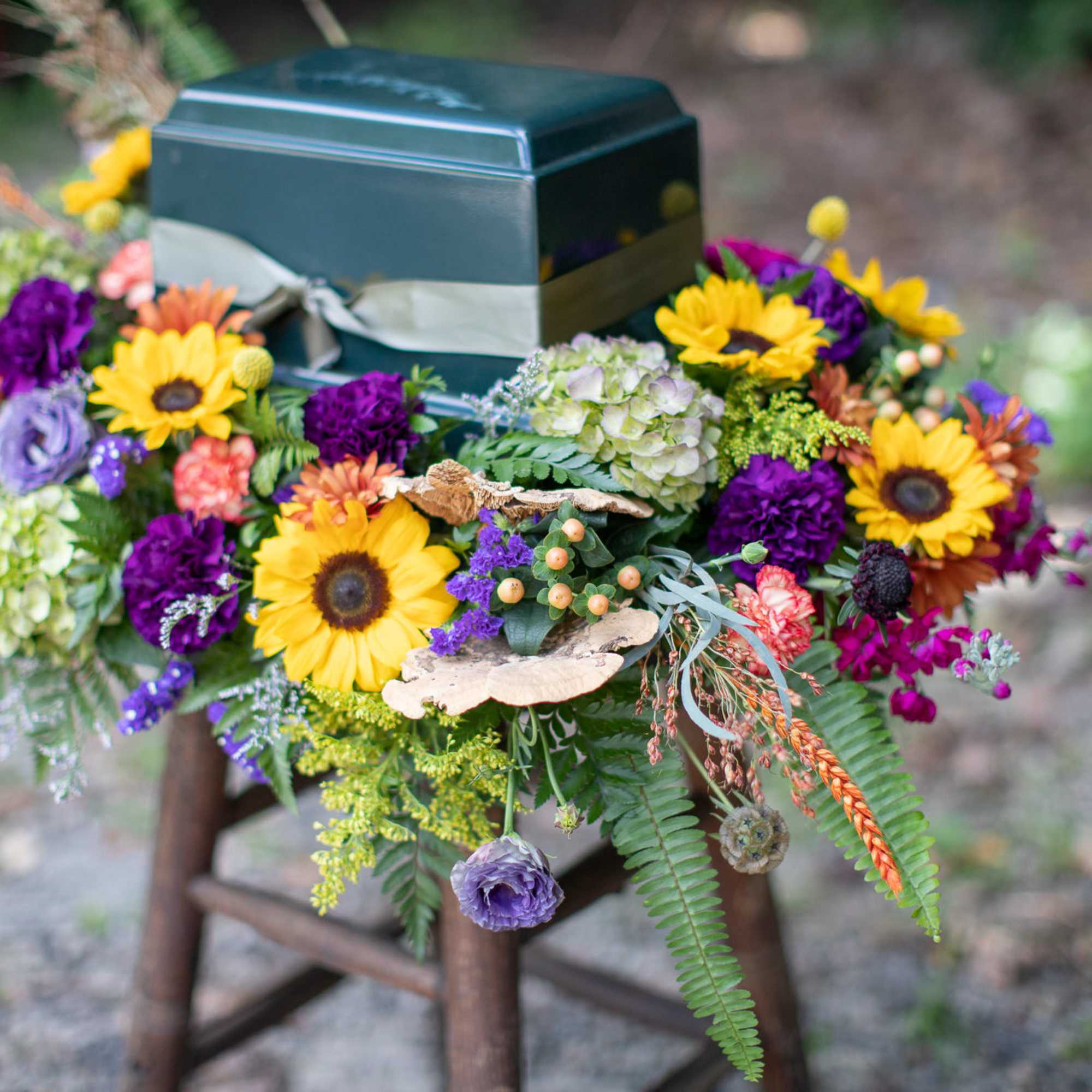 Seasonal funeral flowers are always a beautiful choice. Fall blooms usually include, photo 2 of 3