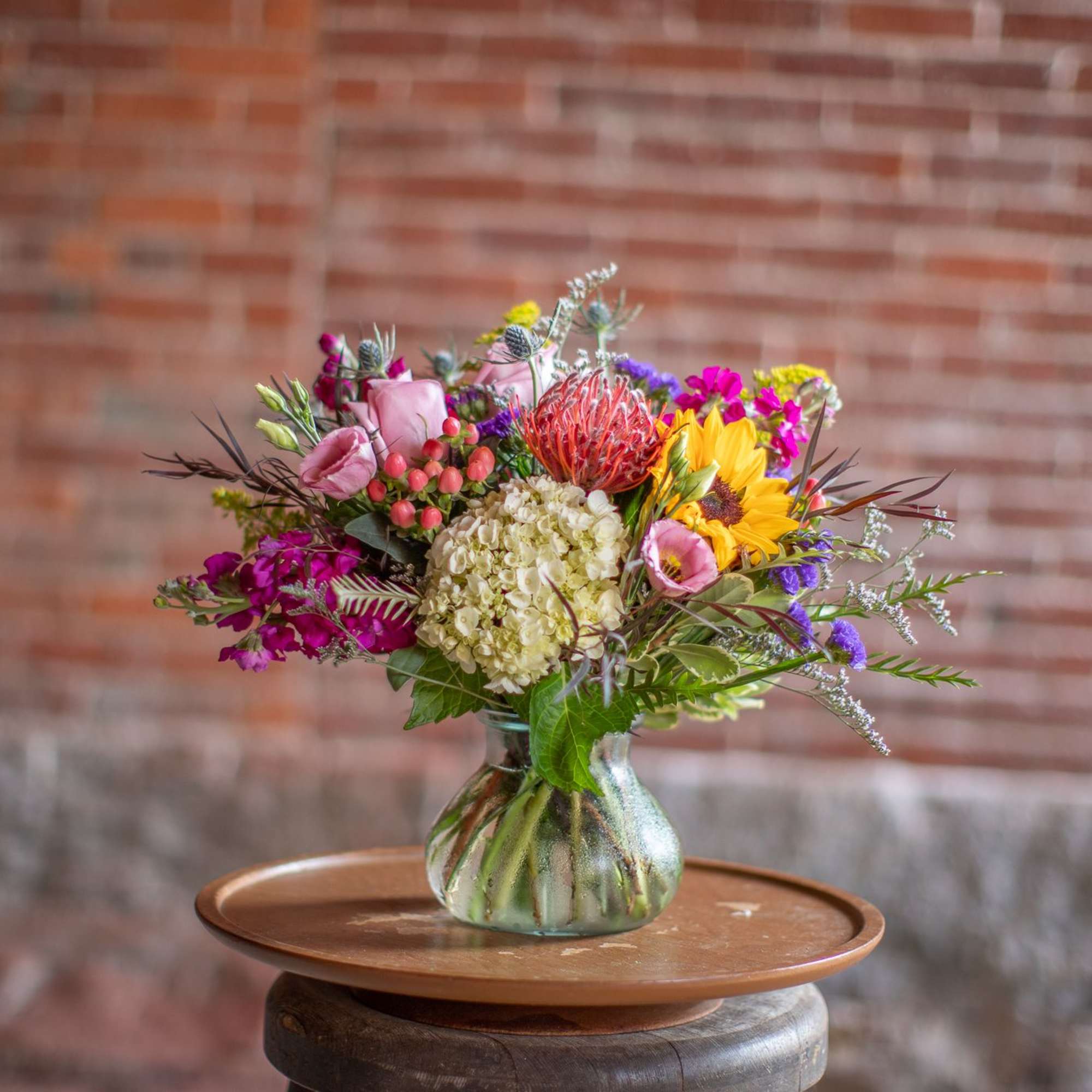Mixed bouquet in a glass vase with a sunflower and pink blooms, photo 5 of 5