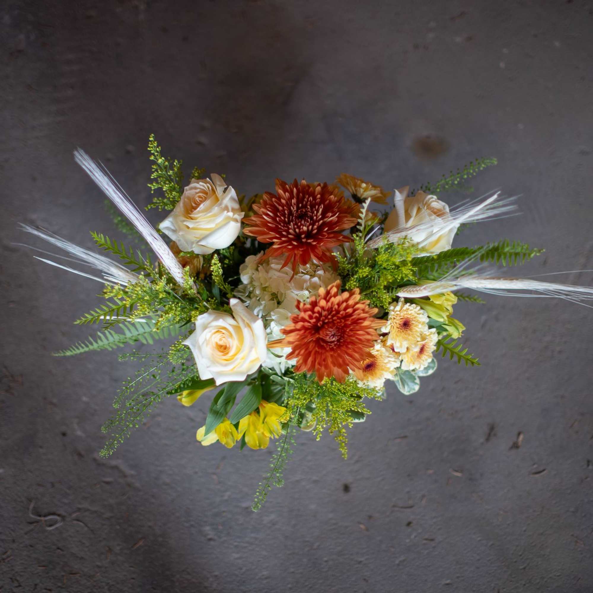 Wonderful bleached wheat whisps from pretty vintage-toned fall blooms in a shallow, photo 2 of 3