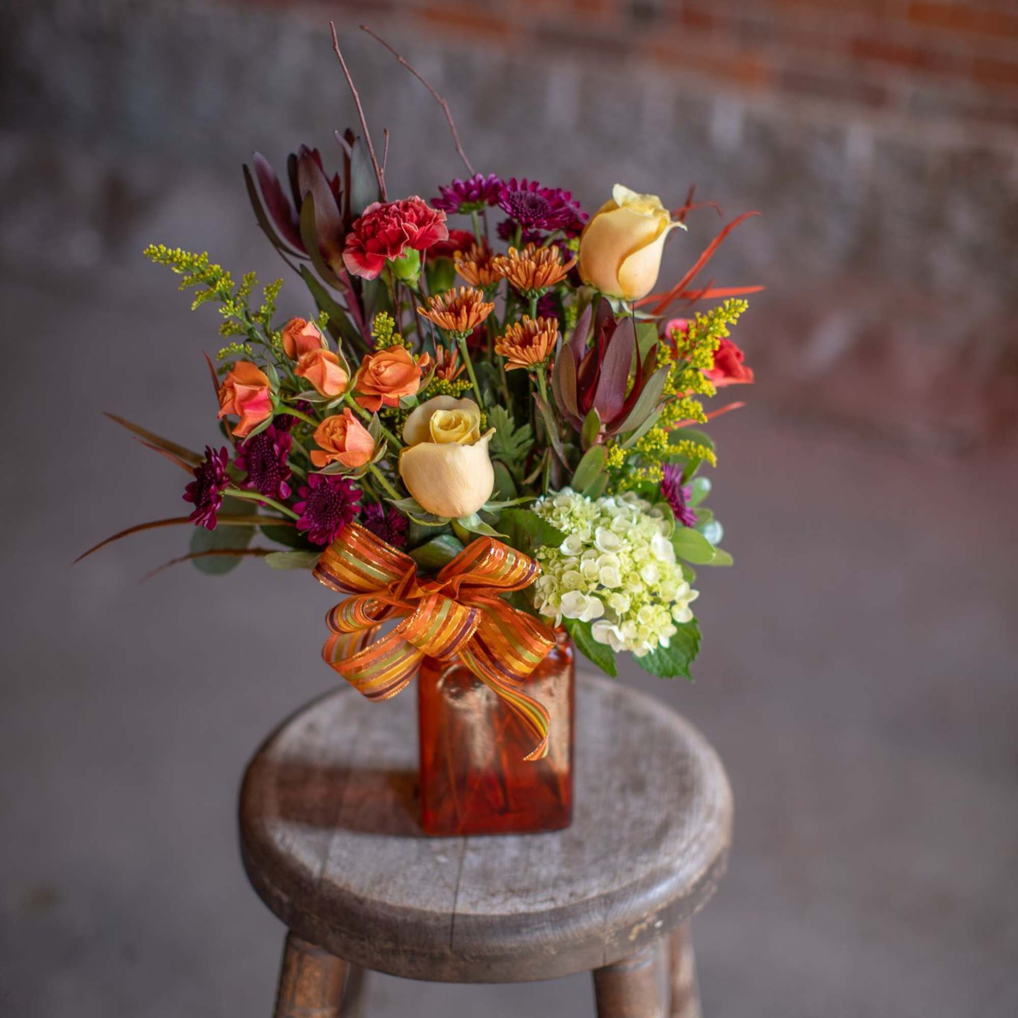 A rectangular shaped vase in an autumnal hue (orange, green, rust, or, photo 3 of 3